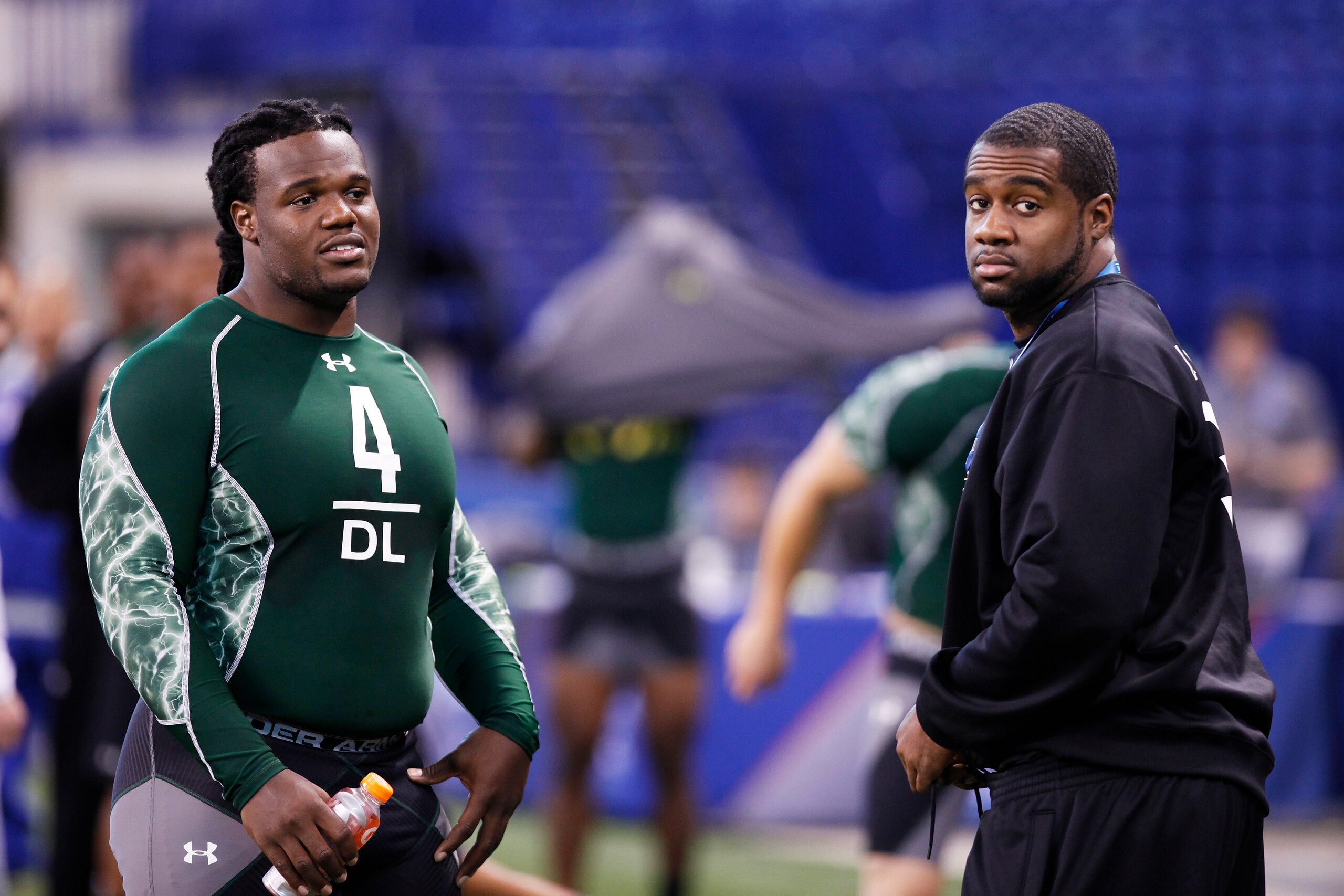 INDIANAPOLIS, IN - FEBRUARY 28: Former North Carolina teammates Marvin Austin (L) and Bruce Carter look on during the 2011 NFL Scouting Combine at Lucas Oil Stadium on February 28, 2011 in Indianapolis, Indiana. (Photo by Joe Robbins/Getty Images)