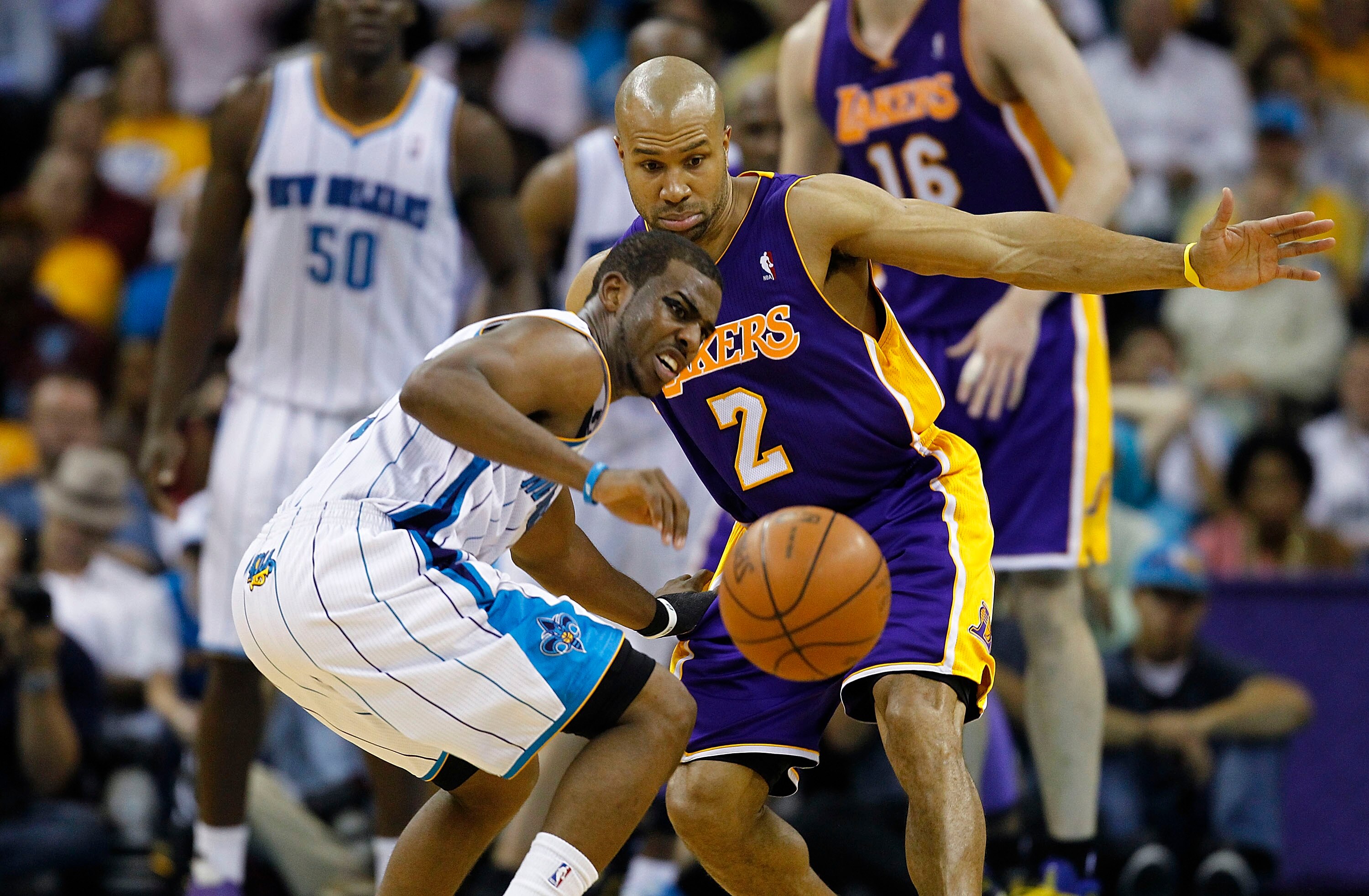 NEW ORLEANS, LA - APRIL 24:  Chris Paul #3 of the New Orleans Hornets and Derek Fisher #2 of the Los Angeles Lakers scramble for a loose ball in Game Four of the Western Conference Quarterfinals in the 2011 NBA Playoffs at New Orleans Arena on April 24, 2