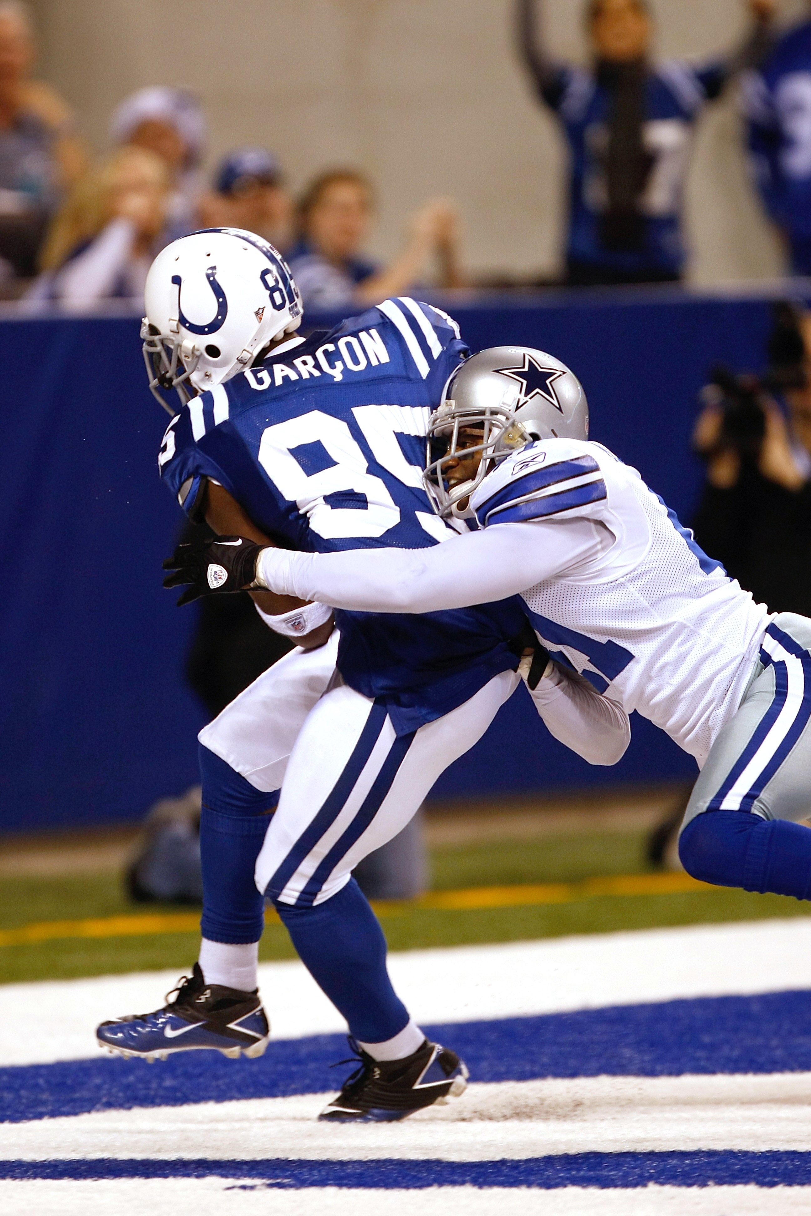 INDIANAPOLIS, IN - DECEMBER 05: Pierre Garcon #85 of the Indianapolis Colts scores a touchdown as Terrence Newman #41 of the Dallas Cowboys defends at Lucas Oil Stadium on December 5, 2010 in Indianapolis, Indiana.  (Photo by Scott Boehm/Getty Images)
