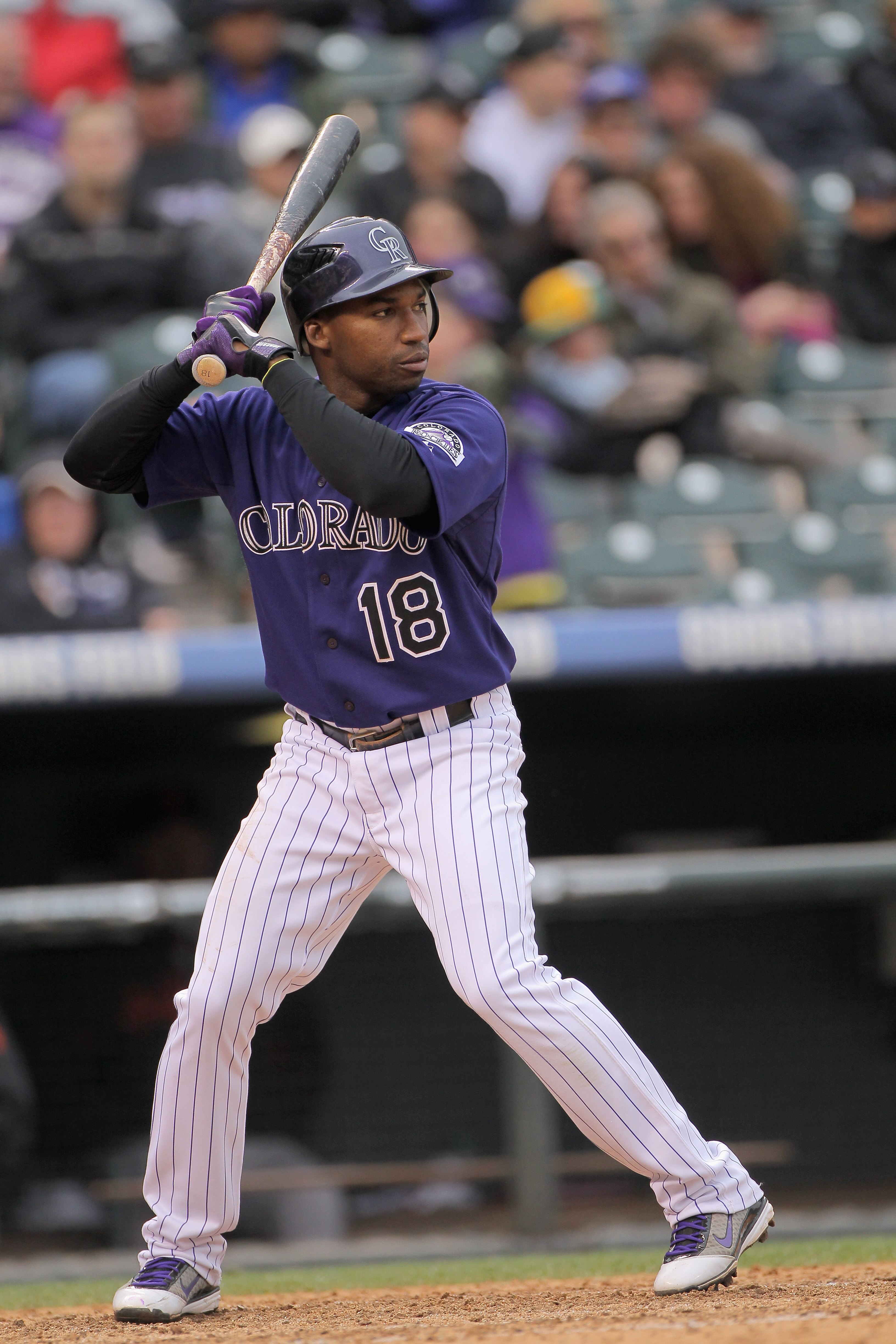 DENVER, CO - APRIL 20:  Second baseman Jonathan Herrera #18 of the Colorado Rockies takes an at bat against the San Francisco Giants at Coors Field on April 20, 2011 in Denver, Colorado.  (Photo by Doug Pensinger/Getty Images)