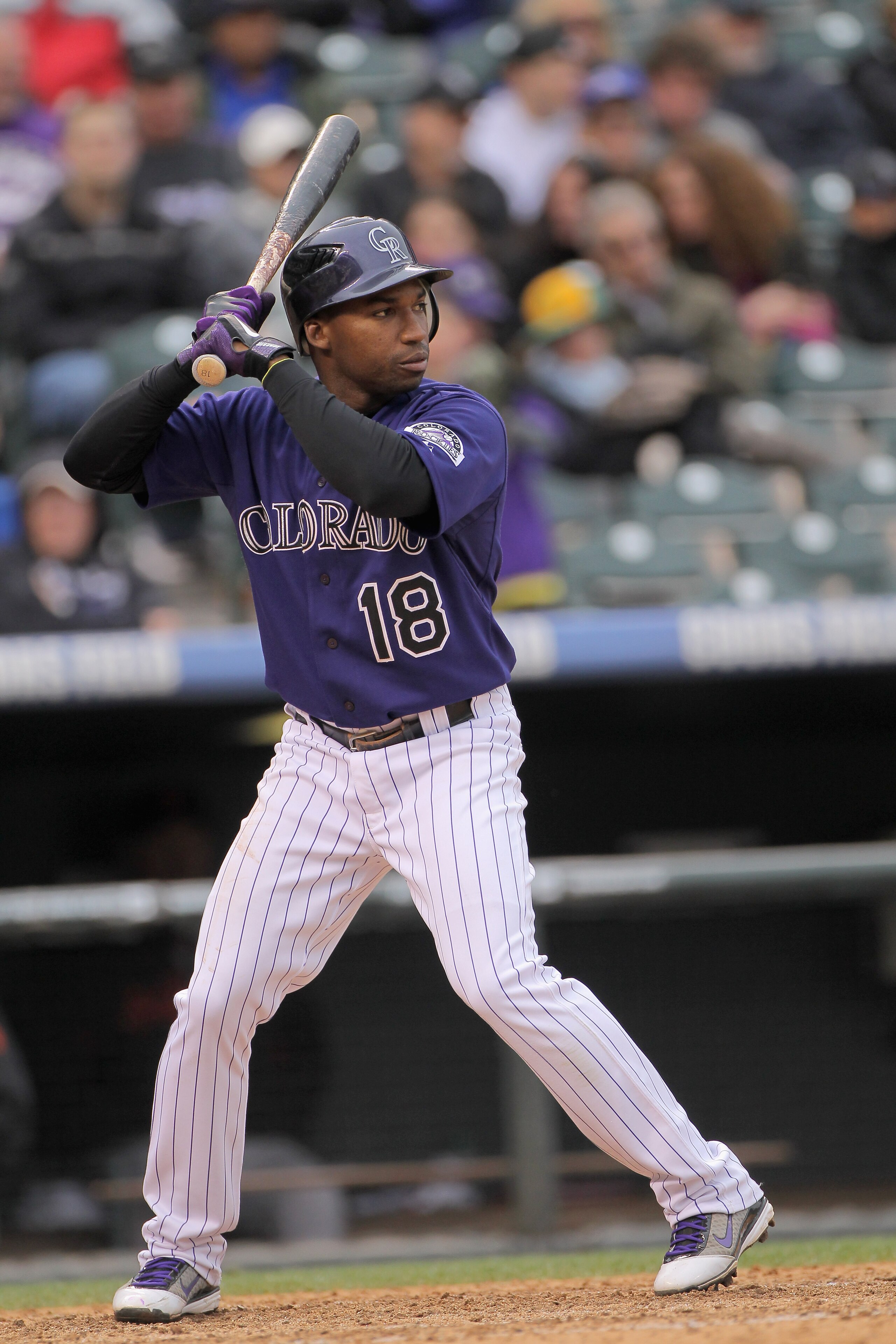 DENVER, CO - APRIL 20: Second baseman Jonathan Herrera #18 of the Colorado Rockies takes an at bat against the San Francisco Giants at Coors Field on April 20, 2011 in Denver, Colorado. (Photo by Doug Pensinger/Getty Images) DENVER, CO - APRIL 20: Second baseman Jonathan Herrera #18 of the Colorado Rockies takes an at bat against the San Francisco Giants at Coors Field on April 20, 2011 in Denver, Colorado. (Photo by Doug Pensinger/Getty Images)