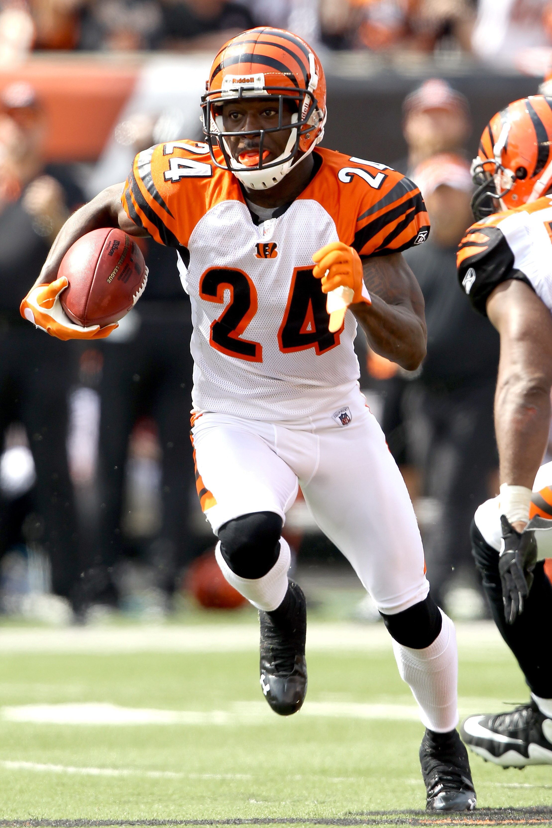 CINCINNATI - SEPTEMBER 19:  Cornerback Adam Jones #24 of the Cincinnati Bengals carries the ball after intercepting a pass against the Baltimore Ravens at Paul Brown Stadium on September 19, 2010 in Cincinnati, Ohio.  (Photo by Matthew Stockman/Getty Imag