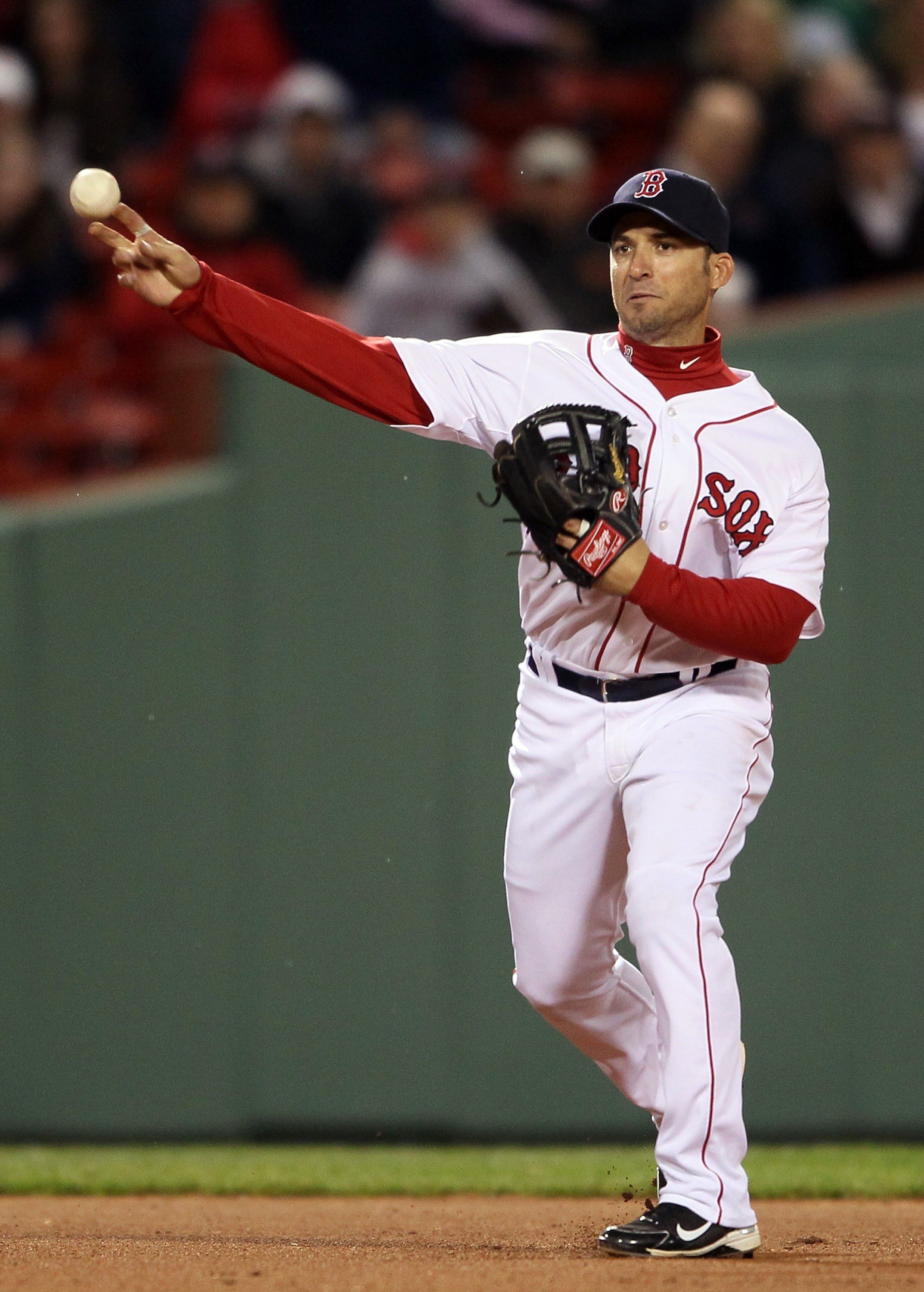 BOSTON, MA - APRIL 12:  Marco Scutaro #10 of the Boston Red Sox sends the ball to first against the Tampa Bay Rays on April 12, 2011 at Fenway Park in Boston, Massachusetts.  (Photo by Elsa/Getty Images)