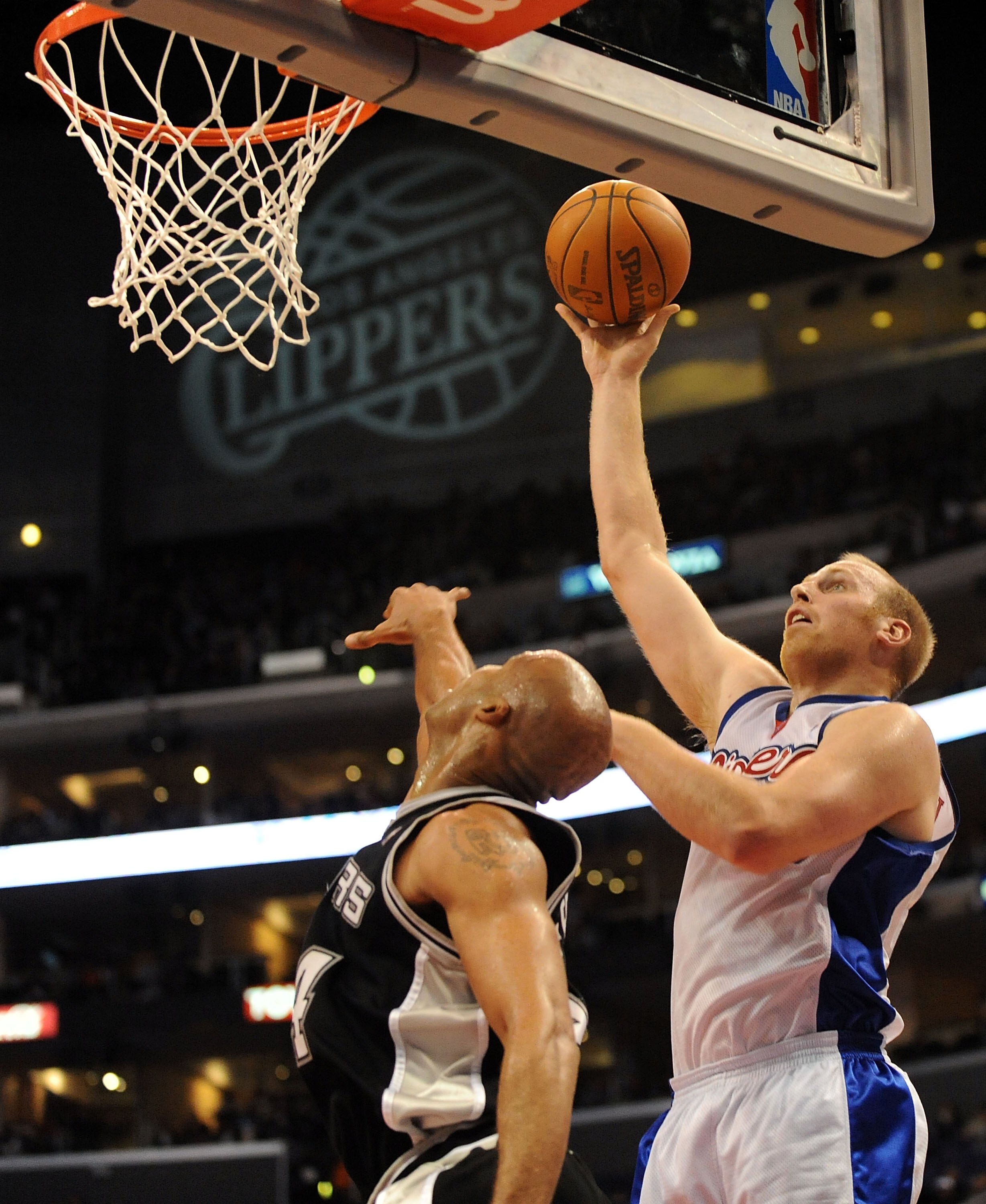 LOS ANGELES, CA - DECEMBER 13:  Chris Kaman #35 of the Los Angeles Clippers shoots a jumper over Richard Jefferson #24 of the San Antonio Spurs at Staples Center on December 13, 2009 in Los Angeles, California.  NOTE TO USER: User expressly acknowledges a