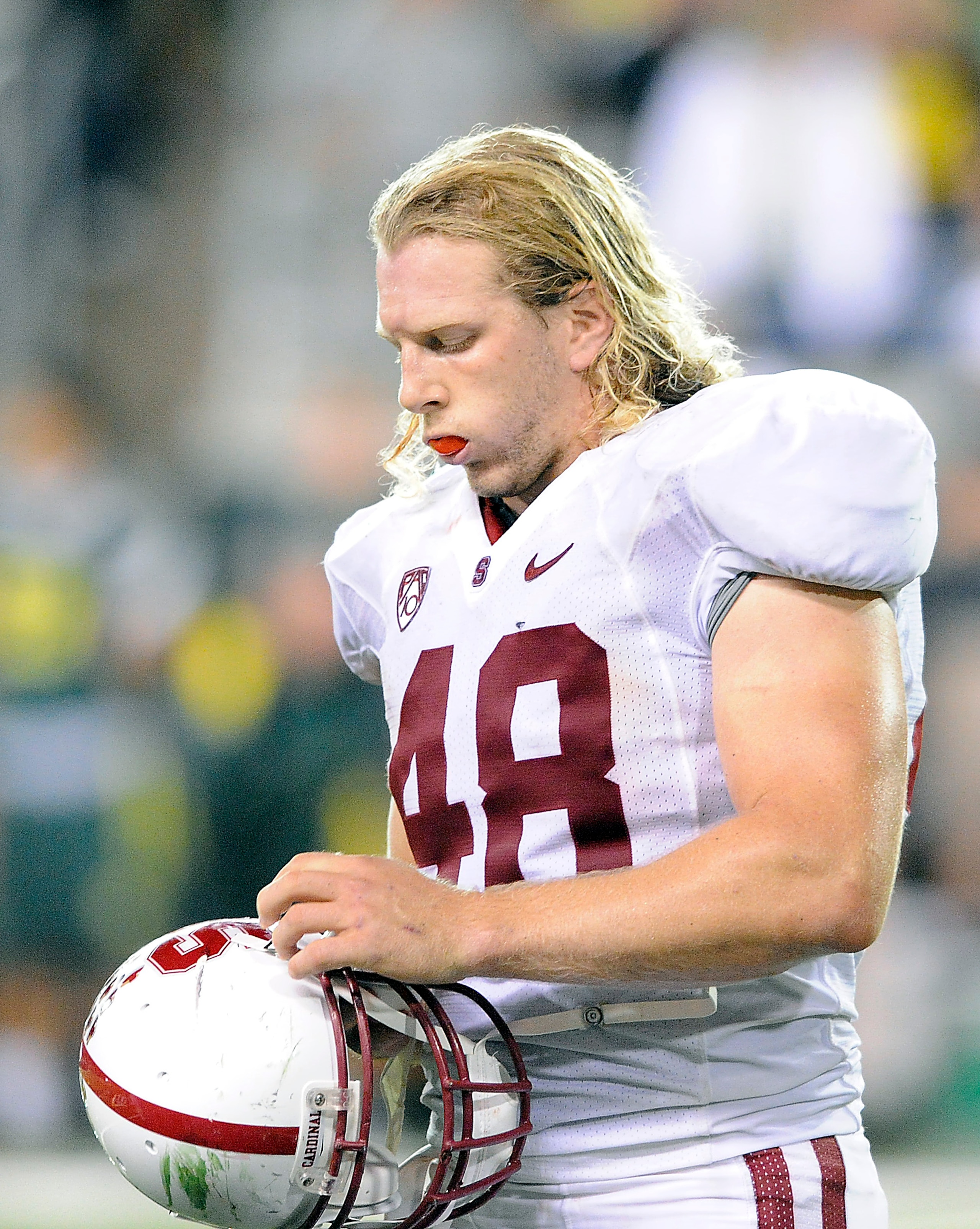 EUGENE, OR - OCTOBER 2: Fullback Owen Marecic #48 of the Stanford Cardinal adjusts his helmet during a timeout in the fourth quarter of the game against the Oregon Ducks at Autzen Stadium on October 2, 2010 in Eugene, Oregon. Oregon won the game 52-31. (P