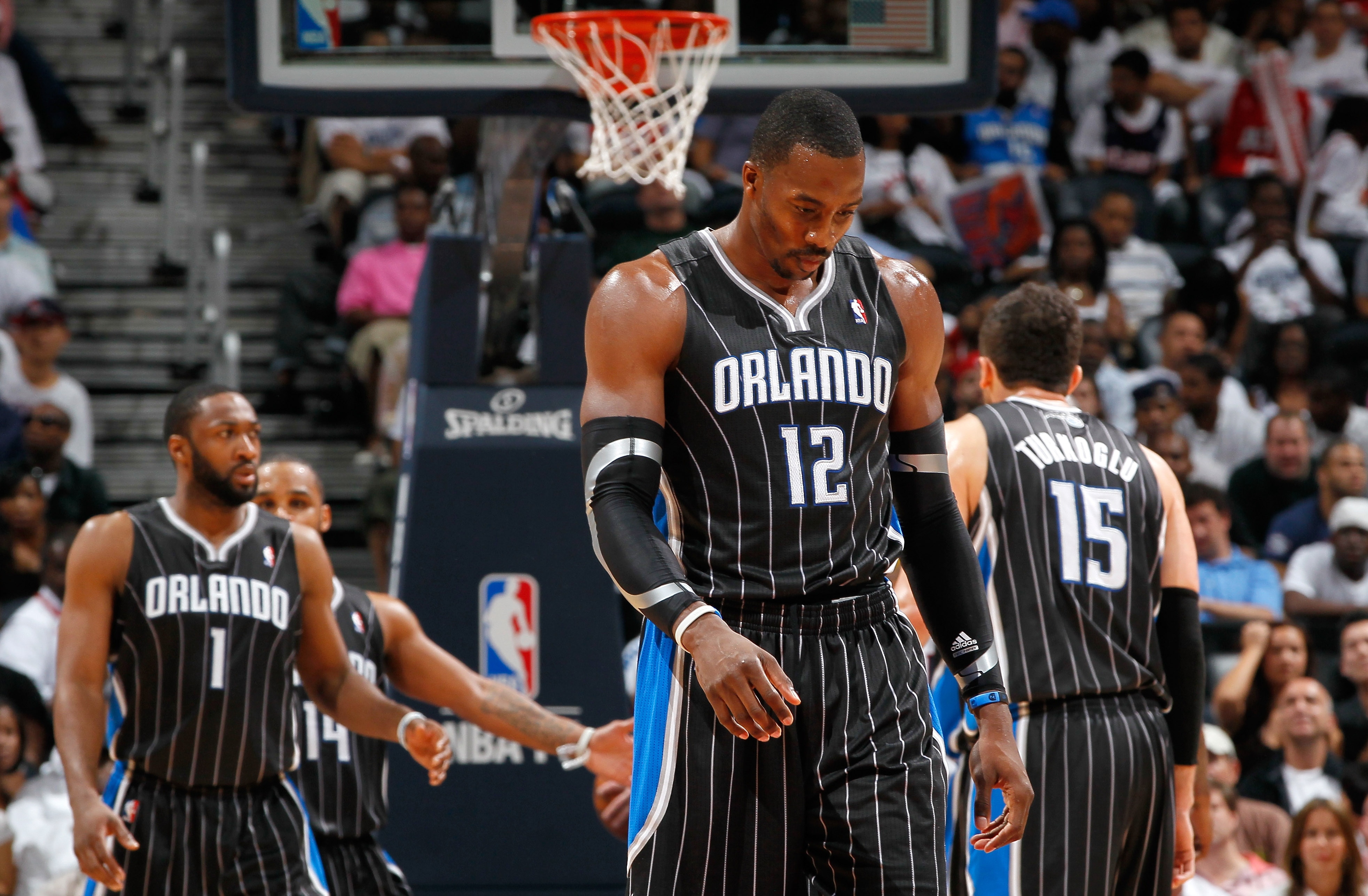 ATLANTA, GA - APRIL 24:  Dwight Howard #12 of the Orlando Magic walks downcourt after a turnover to the Atlanta Hawks during Game Four of the Eastern Conference Quarterfinals in the 2011 NBA Playoffs at Philips Arena on April 24, 2011 in Atlanta, Georgia.