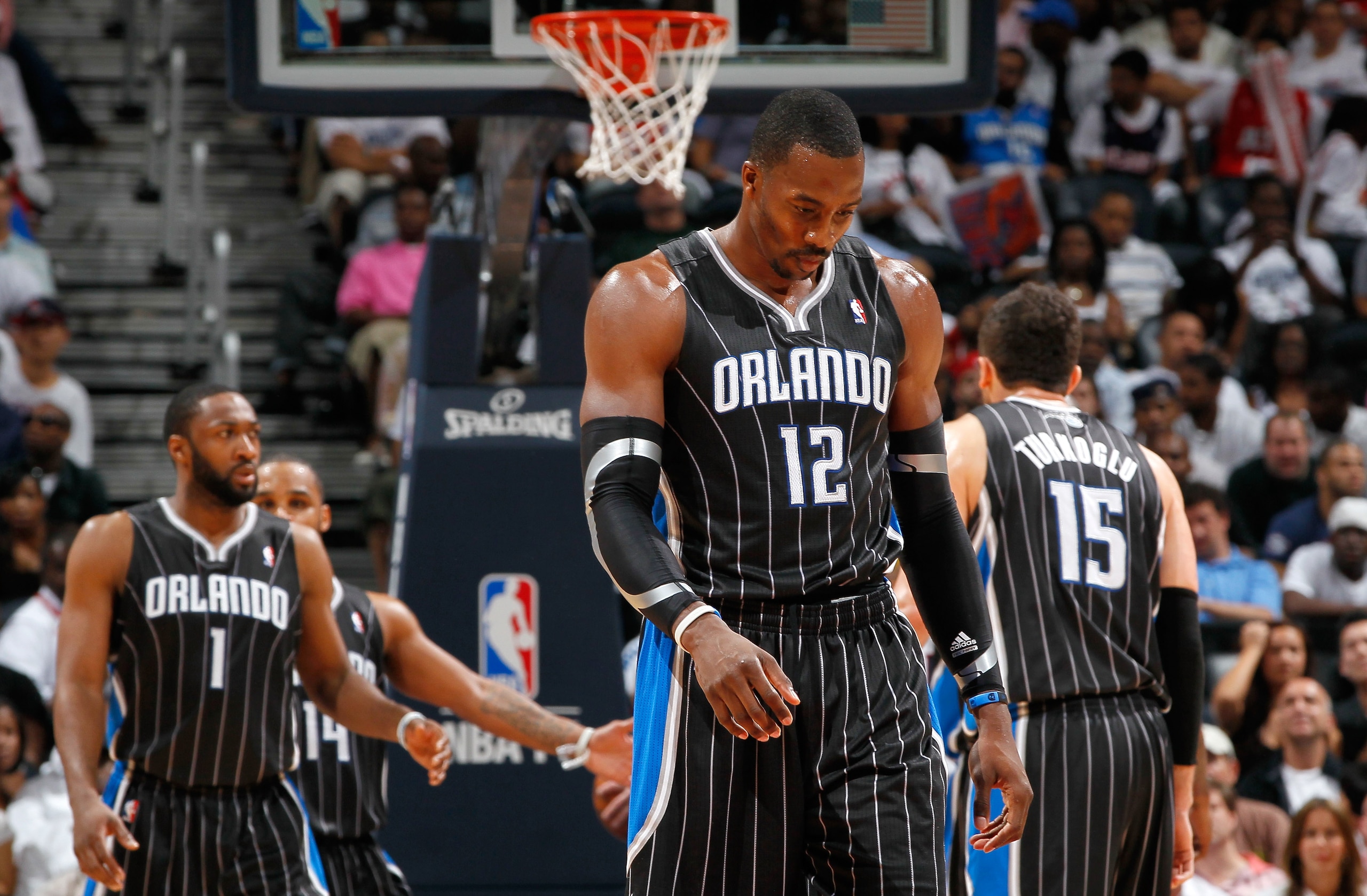 ATLANTA, GA - APRIL 24: Dwight Howard #12 of the Orlando Magic walks downcourt after a turnover to the Atlanta Hawks during Game Four of the Eastern Conference Quarterfinals in the 2011 NBA Playoffs at Philips Arena on April 24, 2011 in Atlanta, Georgia. ATLANTA, GA - APRIL 24: Dwight Howard #12 of the Orlando Magic walks downcourt after a turnover to the Atlanta Hawks during Game Four of the Eastern Conference Quarterfinals in the 2011 NBA Playoffs at Philips Arena on April 24, 2011 in Atlanta, Georgia.