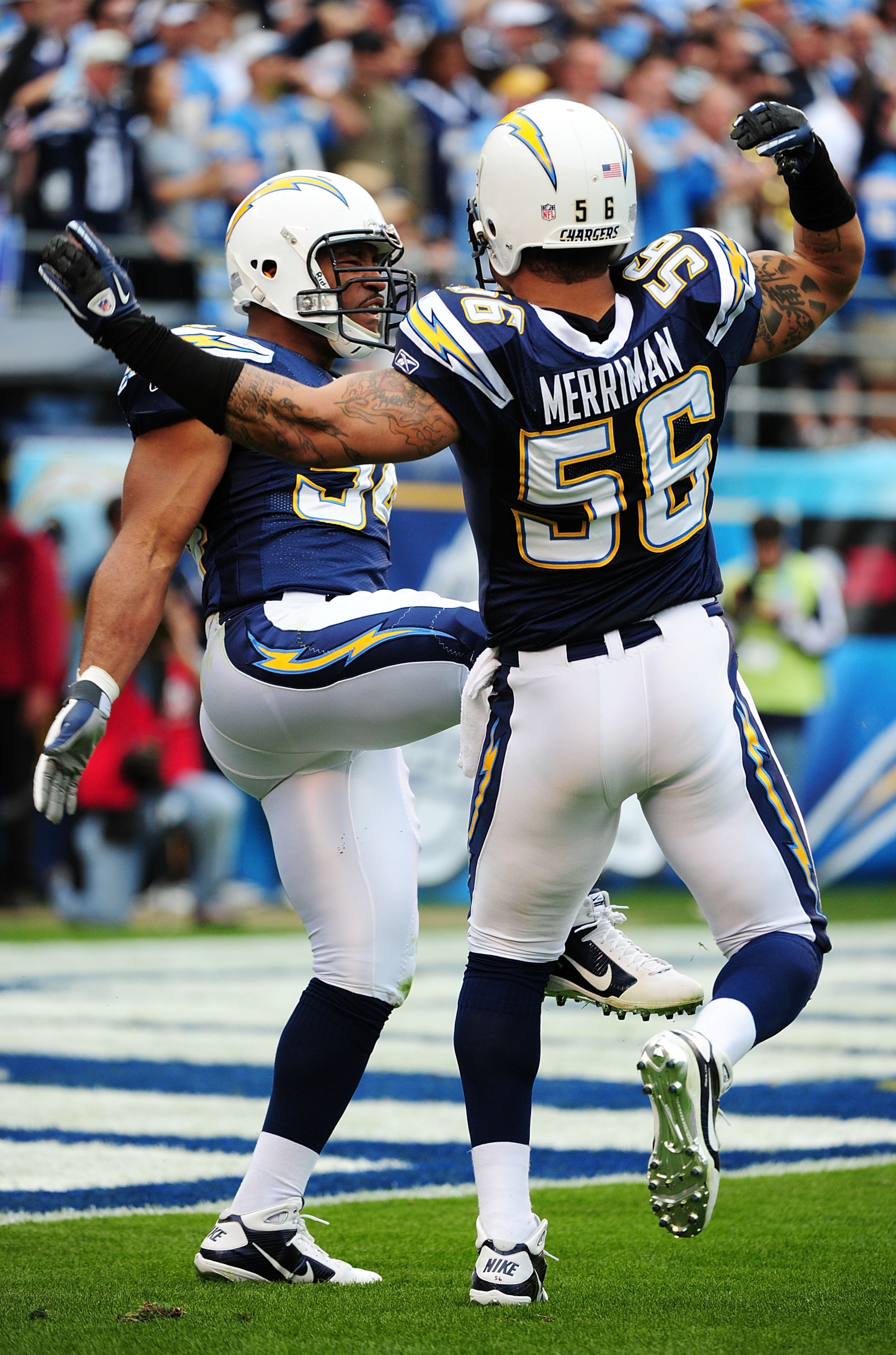 SAN DIEGO - JANUARY 17:  Linebackers Shawne Merriman #56 and  Stephen Cooper #54 of the San Diego Chargers celebrate a defensive play against the New York Jets during the AFC Divisional Playoff Game at Qualcomm Stadium on January 17, 2010 in San Diego, Ca