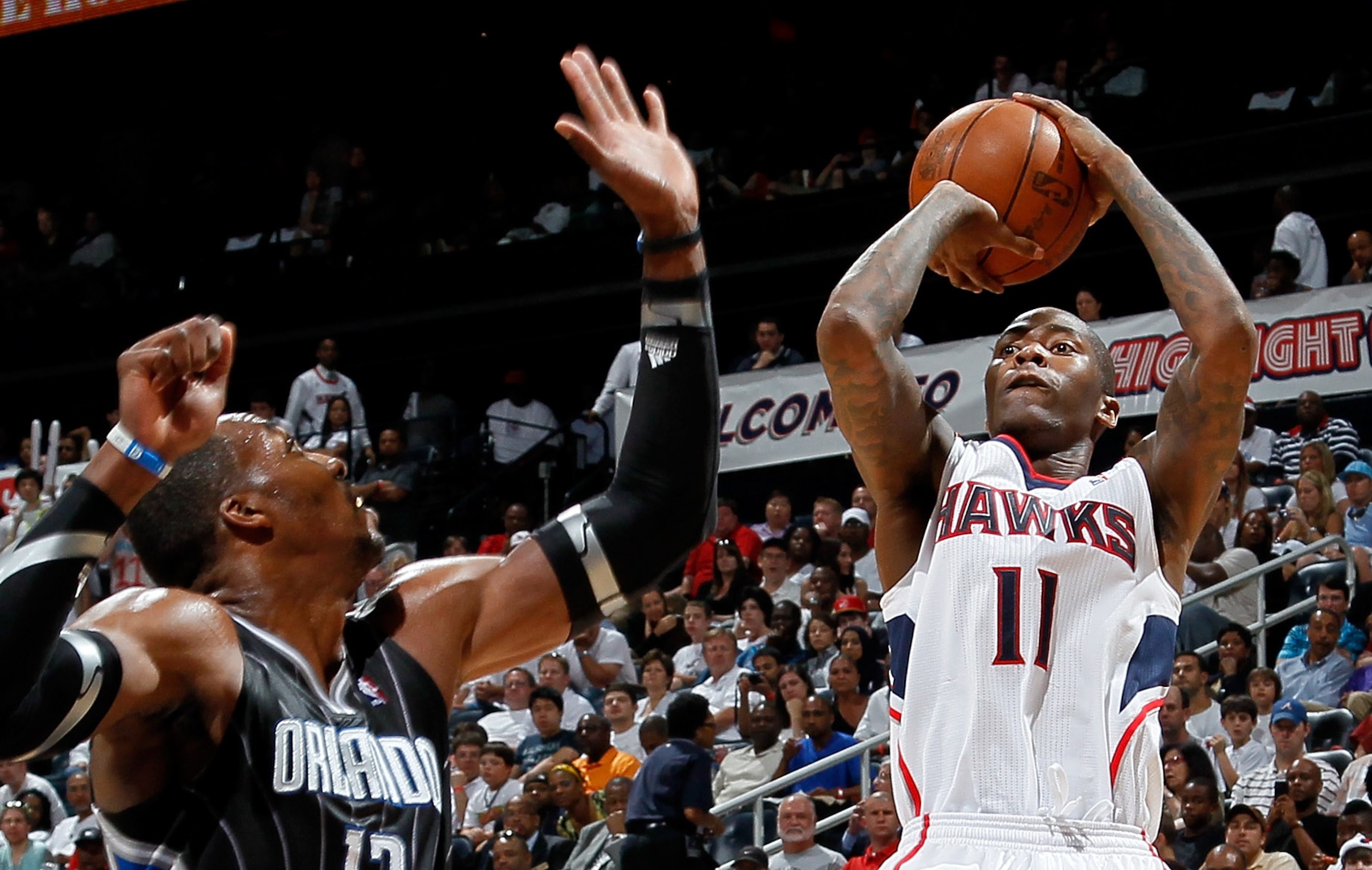 ATLANTA, GA - APRIL 24: Jamal Crawford #11 of the Atlanta Hawks shoots over Dwight Howard #12 of the Orlando Magic during Game Four of the Eastern Conference Quarterfinals in the 2011 NBA Playoffs at Philips Arena on April 24, 2011 in Atlanta, Georgia. ATLANTA, GA - APRIL 24: Jamal Crawford #11 of the Atlanta Hawks shoots over Dwight Howard #12 of the Orlando Magic during Game Four of the Eastern Conference Quarterfinals in the 2011 NBA Playoffs at Philips Arena on April 24, 2011 in Atlanta, Georgia.