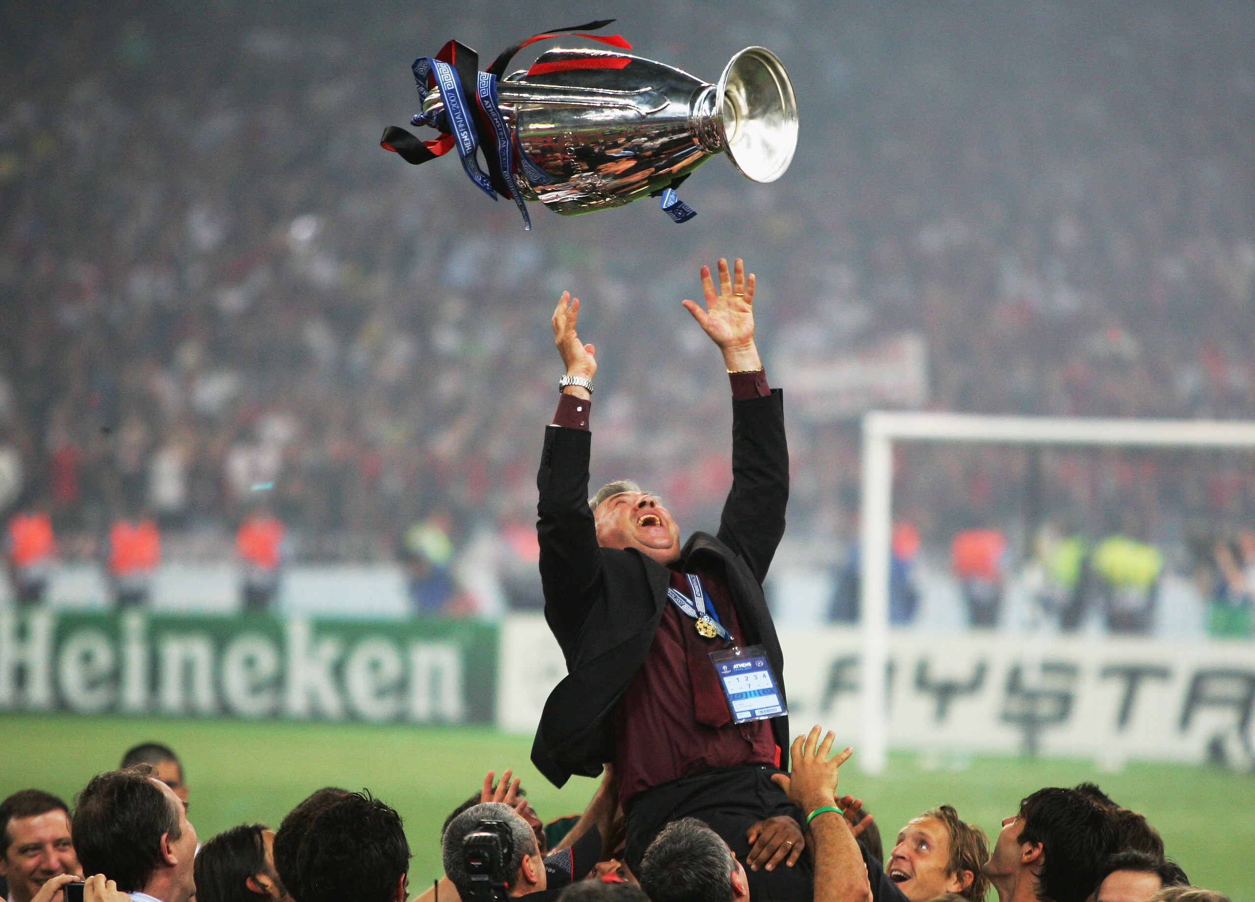 ATHENS, GREECE - MAY 23: Carlo Ancelotti, the Milan manager throws the trophy in the air, whilst celebrating his teams 2-1 victoryduring the UEFA Champions League Final match between Liverpool and AC Milan at the Olympic Stadium on May 23, 2007 in Athens ATHENS, GREECE - MAY 23: Carlo Ancelotti, the Milan manager throws the trophy in the air, whilst celebrating his teams 2-1 victoryduring the UEFA Champions League Final match between Liverpool and AC Milan at the Olympic Stadium on May 23, 2007 in Athens