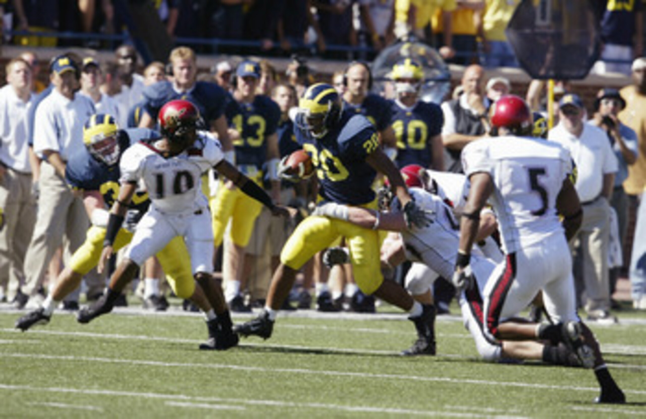 ANN ARBOR - SEPTEMBER 18:  Running back Mike Hart #20 of the University of Michigan Wolverines is tackled by the San Diego State University Aztecs during the game at Michigan Stadium on September 18, 2004, in Ann Arbor, Michigan.  The Wolverines defeated