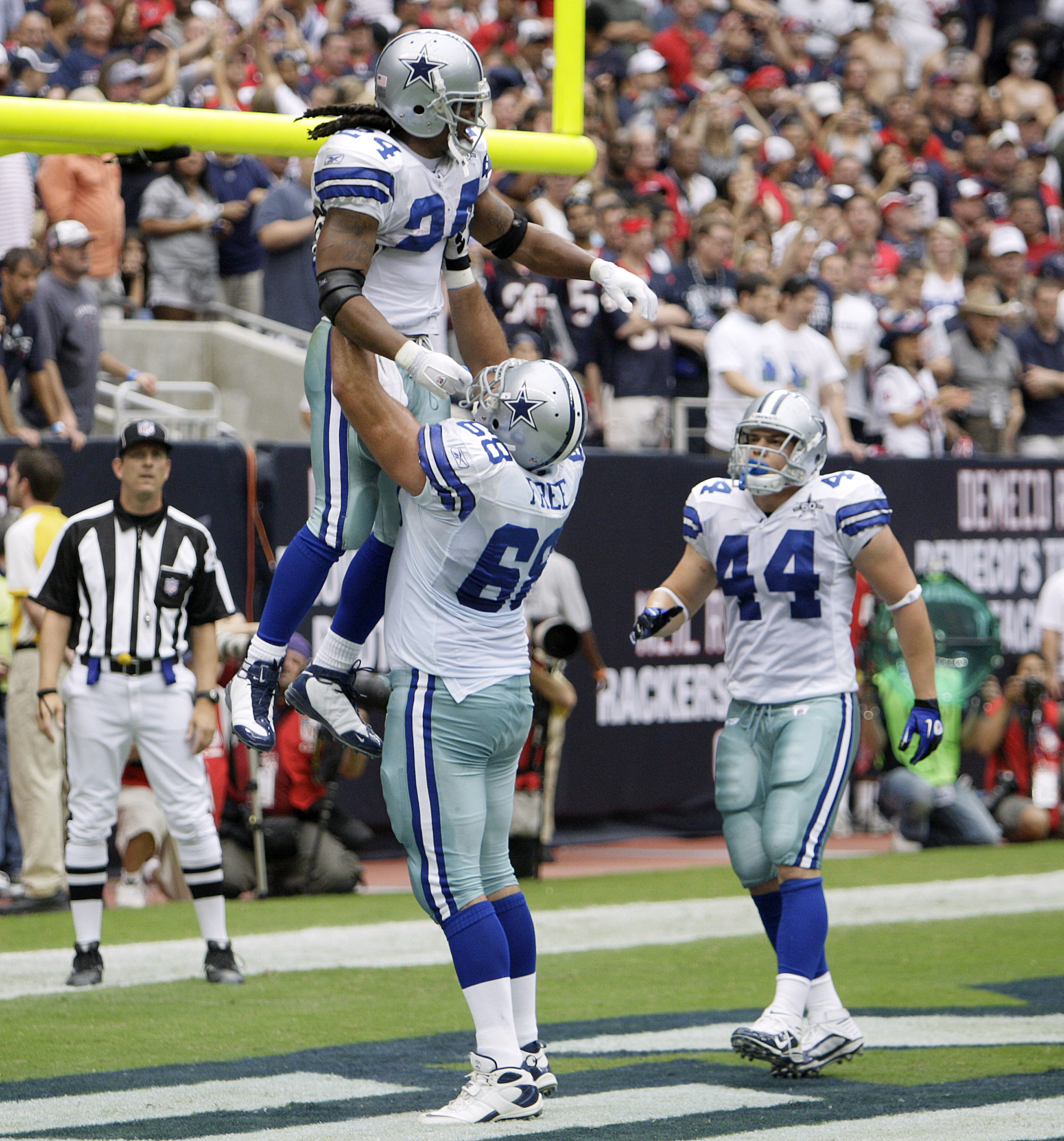 HOUSTON - SEPTEMBER 26:  Running back Marion Barber #24 of the Dallas Cowboys is lifted up by Doug Free #68 after scoring in the second quarter as Chris Gronkowski #44 looks on against the Houston Texans at Reliant Stadium on September 26, 2010 in Houston