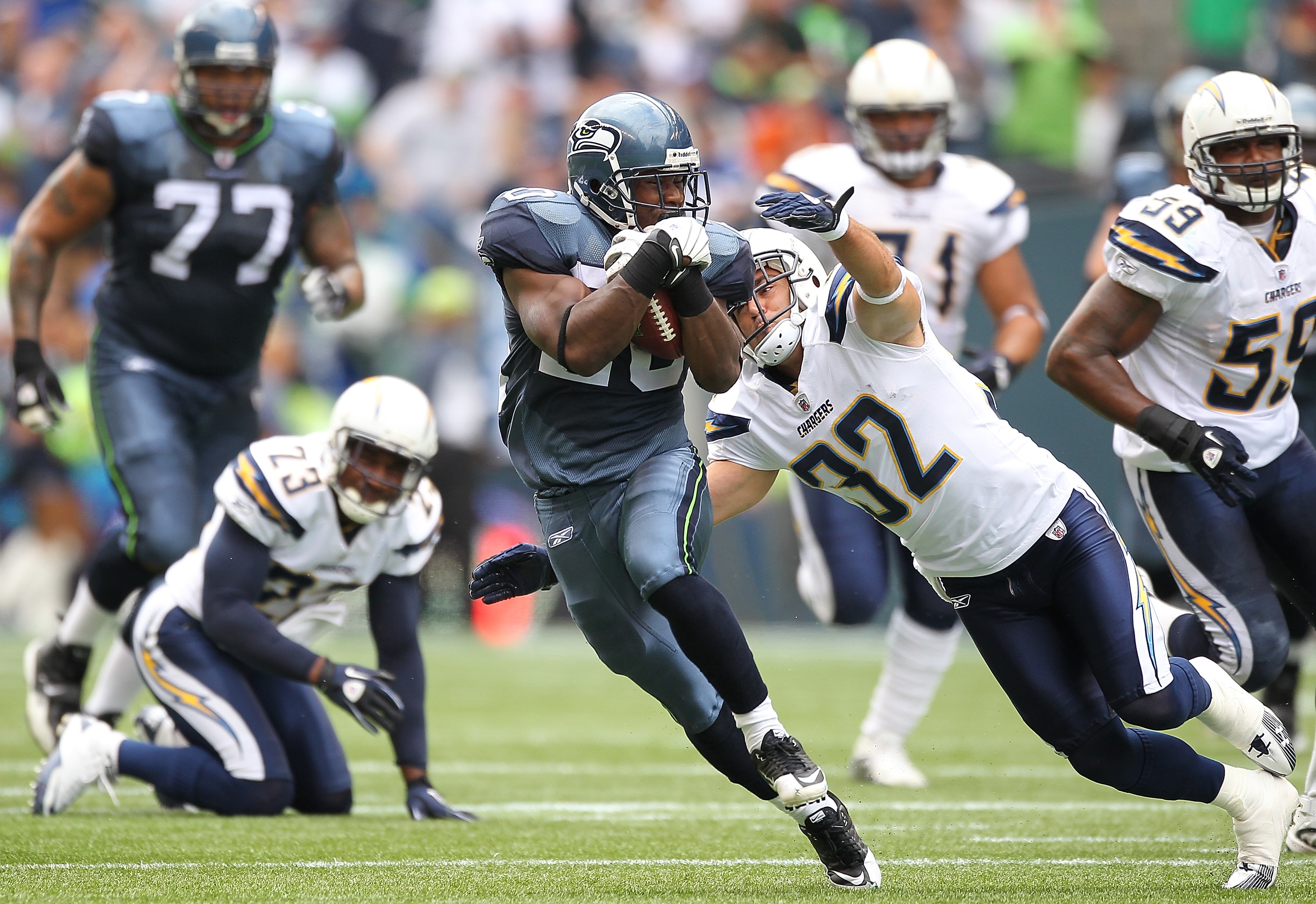 SEATTLE - SEPTEMBER 26:  Running back Justin Forsett #20 of the Seattle Seahawks rushes against Eric Weddle #32 of the San Diego Chargers at Qwest Field on September 26, 2010 in Seattle, Washington. The Seahawks defeated the Chargers 27-20. (Photo by Otto