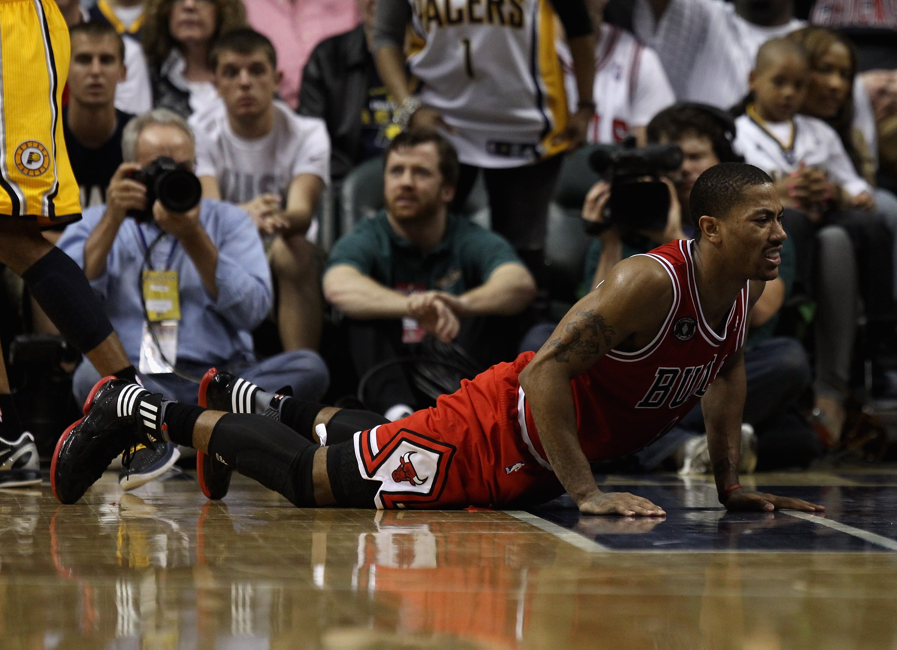 INDIANAPOLIS, IN - APRIL 23: Derrick Rose #1 of the Chicago Bulls picks himself up off of the floor after being knocked down against the Indiana Pacers in Game Four of the Eastern Conference Quarterfinals in the 2011 NBA Playoffs at Conseco Fieldhouse on