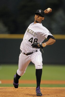 DENVER, CO - APRIL 18:  Starting pitcher Esmil Rogers #48 of the Colorado Rockies delivers against the San Francisco Giants at Coors Field on April 18, 2011 in Denver, Colorado. Rogers collected the loss as the Giants defeated the Rockies 8-1.  (Photo by 