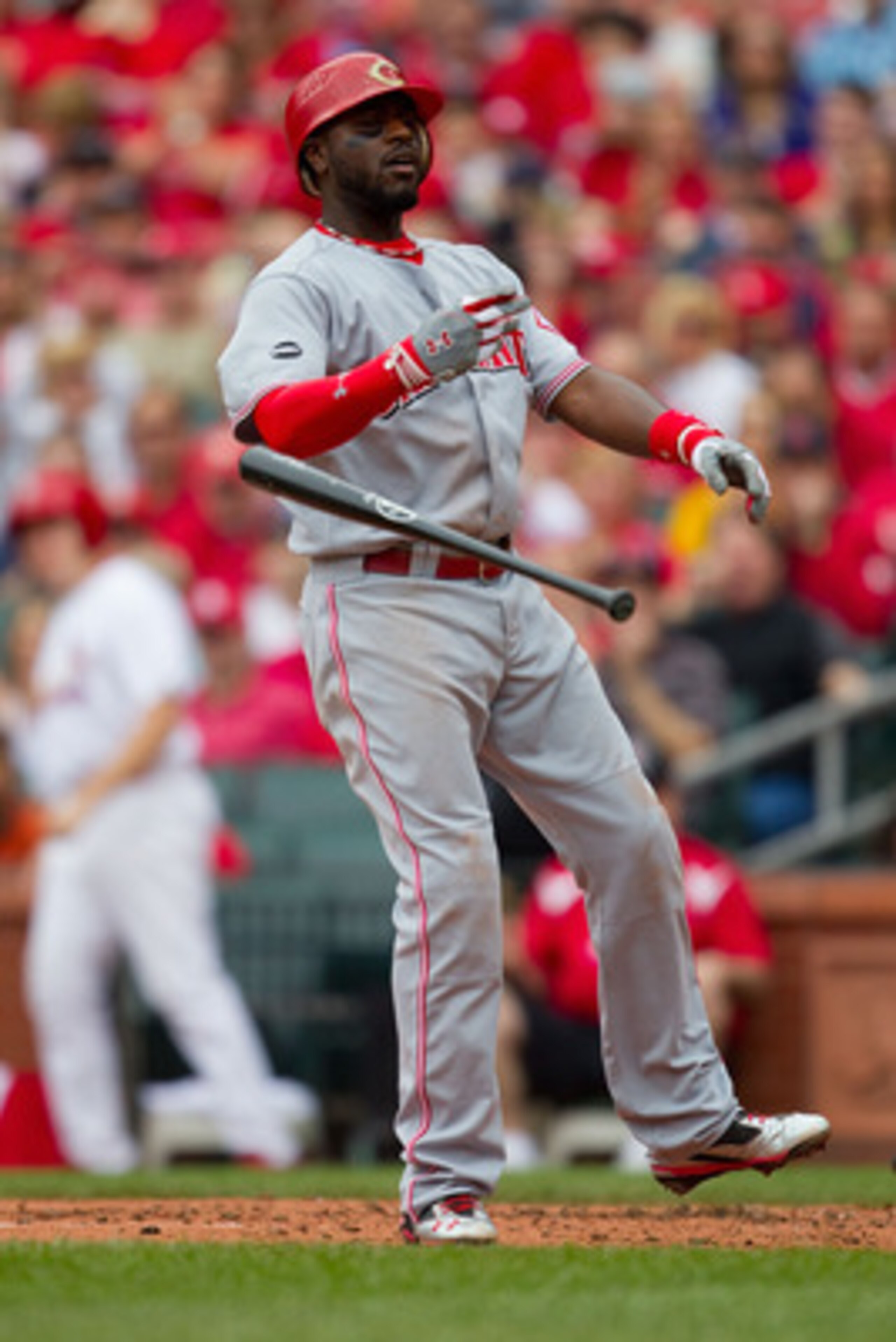 ST. LOUIS, MO - APRIL 23: Brandon Phillips #4 of the Cincinnati Reds reacts to striking out against the St. Louis Cardinals at Busch Stadium on April 23, 2011 in St. Louis, Missouri.  (Photo by Dilip Vishwanat/Getty Images)