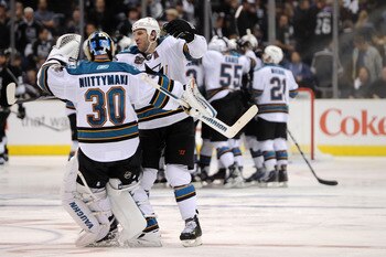 LOS ANGELES, CA - APRIL 19:  Antero Niittymaki #30 and Ryane Clowe #29 of the San Jose Sharks celebrate their 6-5 win over the Los Angeles Kings in overtime of game three of the Western Conference Quarterfinals during the 2011 NHL Stanley Cup Playoffs at