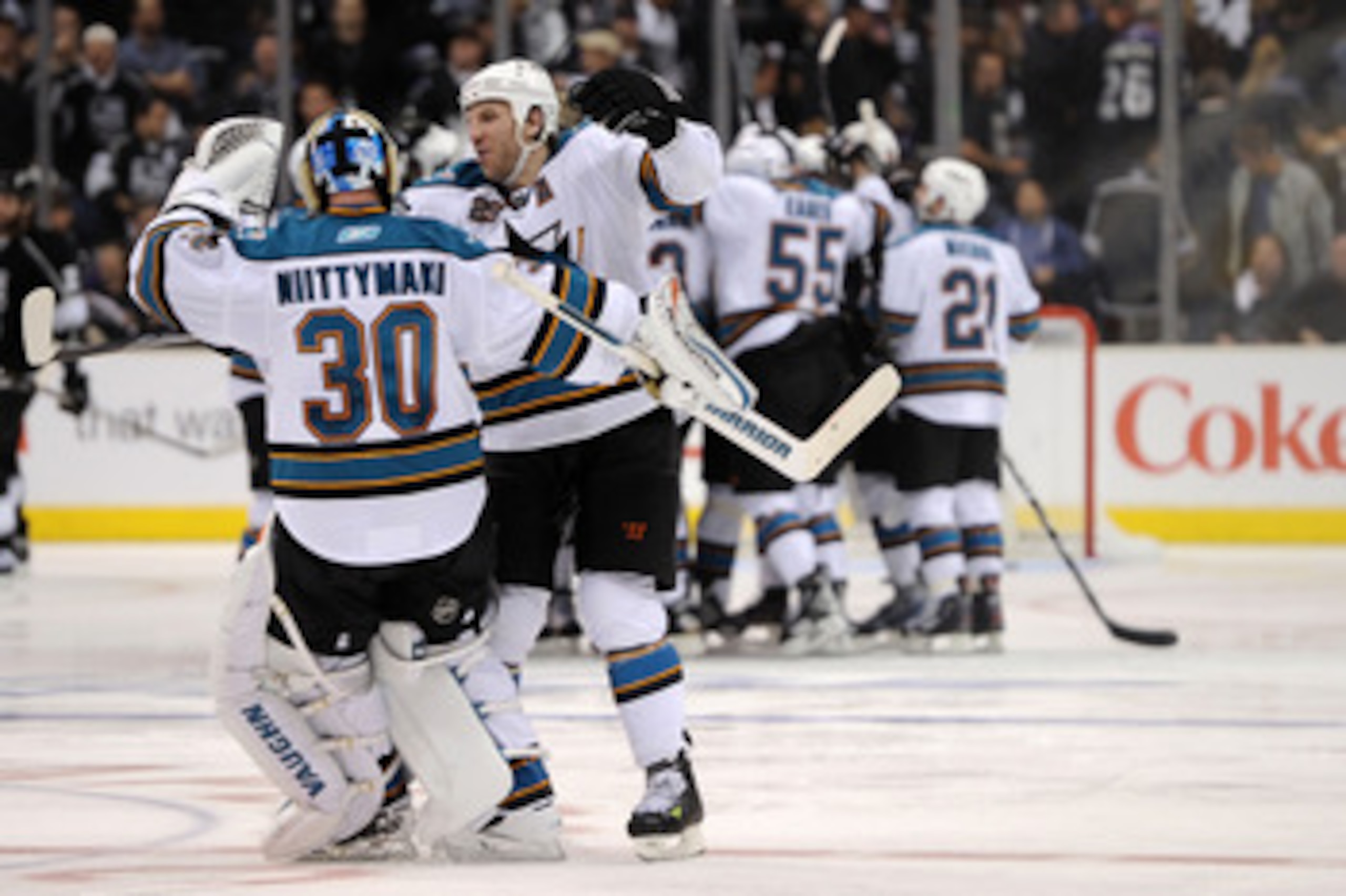 LOS ANGELES, CA - APRIL 19:  Antero Niittymaki #30 and Ryane Clowe #29 of the San Jose Sharks celebrate their 6-5 win over the Los Angeles Kings in overtime of game three of the Western Conference Quarterfinals during the 2011 NHL Stanley Cup Playoffs at