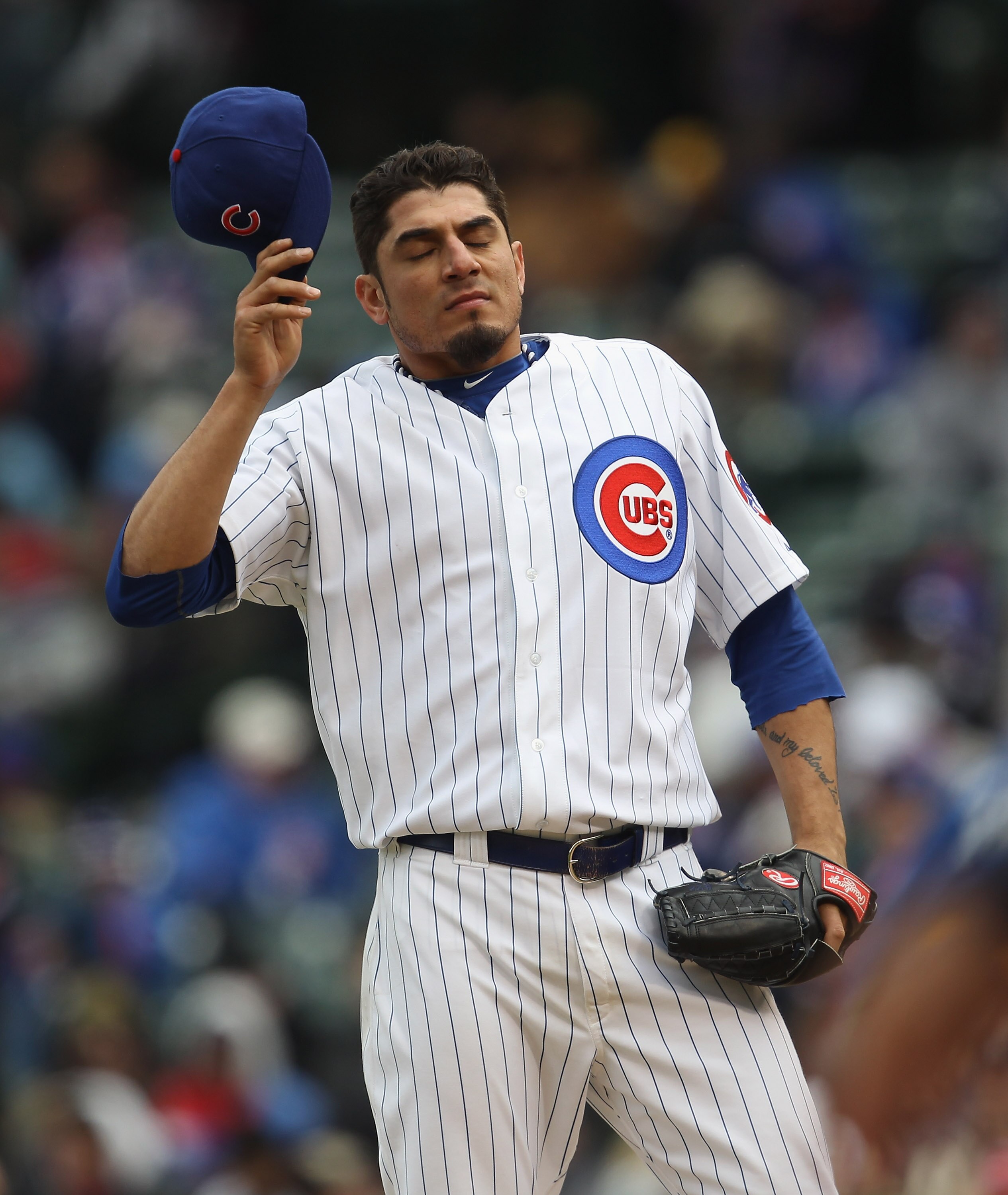CHICAGO, IL - APRIL 20: Starting pitcher Matt Garza #17 of the Chicago Cubs reacts after walking the bases loaded in the 6th inning against the San Diego Padres at Wrigley Field on April 20, 2011 in Chicago, Illinois. The Cuns defeated the Padres 2-1 in 1