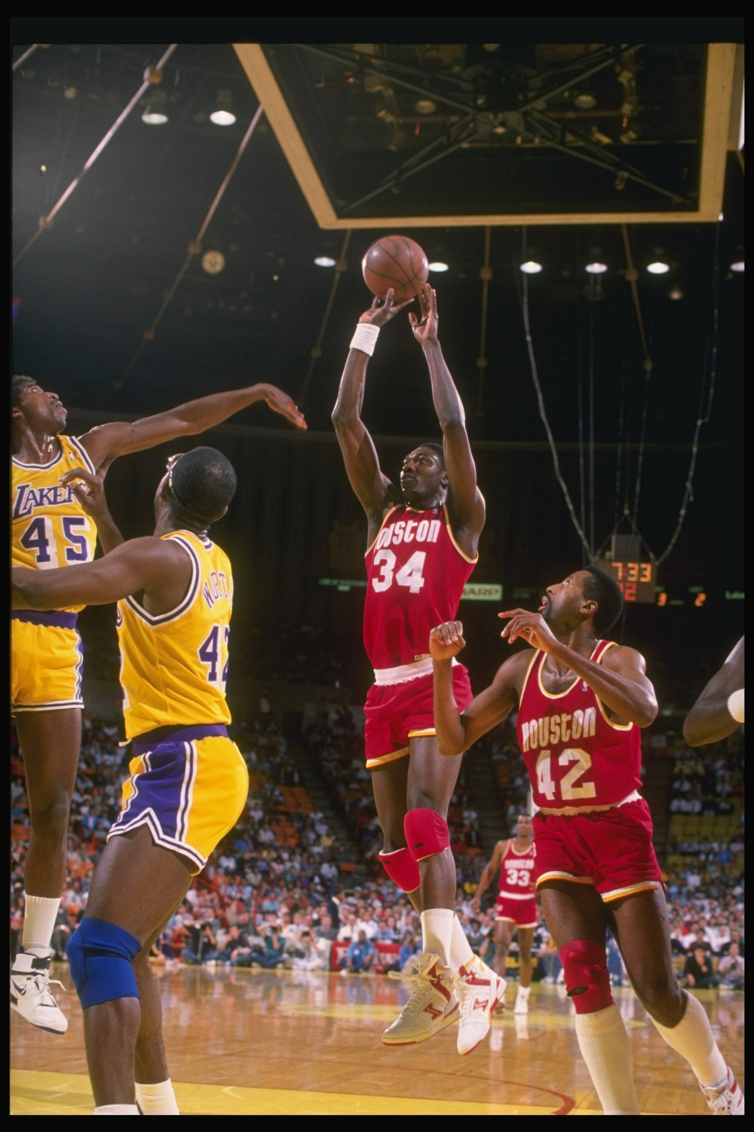 Center Hakeem Olajuwon of the Houston Rockets (center) goes up for two during a game against the Los Angeles Lakers at the Great Western Forum in Inglewood, California. Center Hakeem Olajuwon of the Houston Rockets (center) goes up for two during a game against the Los Angeles Lakers at the Great Western Forum in Inglewood, California.