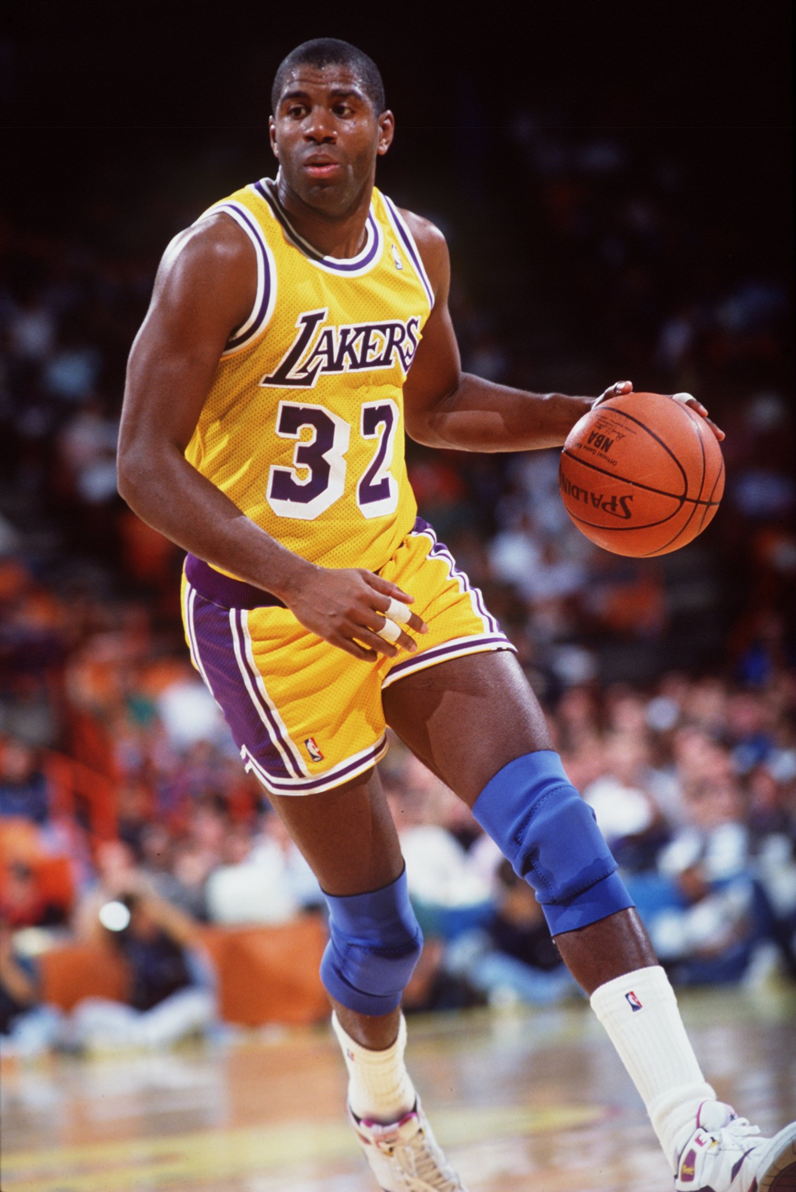 1990-1991: Earvin Magic Johnson of the Los Angeles Lakers in action against the Portland Trailblazers. Mandatory Credit: Stephen Dunn/Allsport 1990-1991: Earvin Magic Johnson of the Los Angeles Lakers in action against the Portland Trailblazers. Mandatory Credit: Stephen Dunn/Allsport