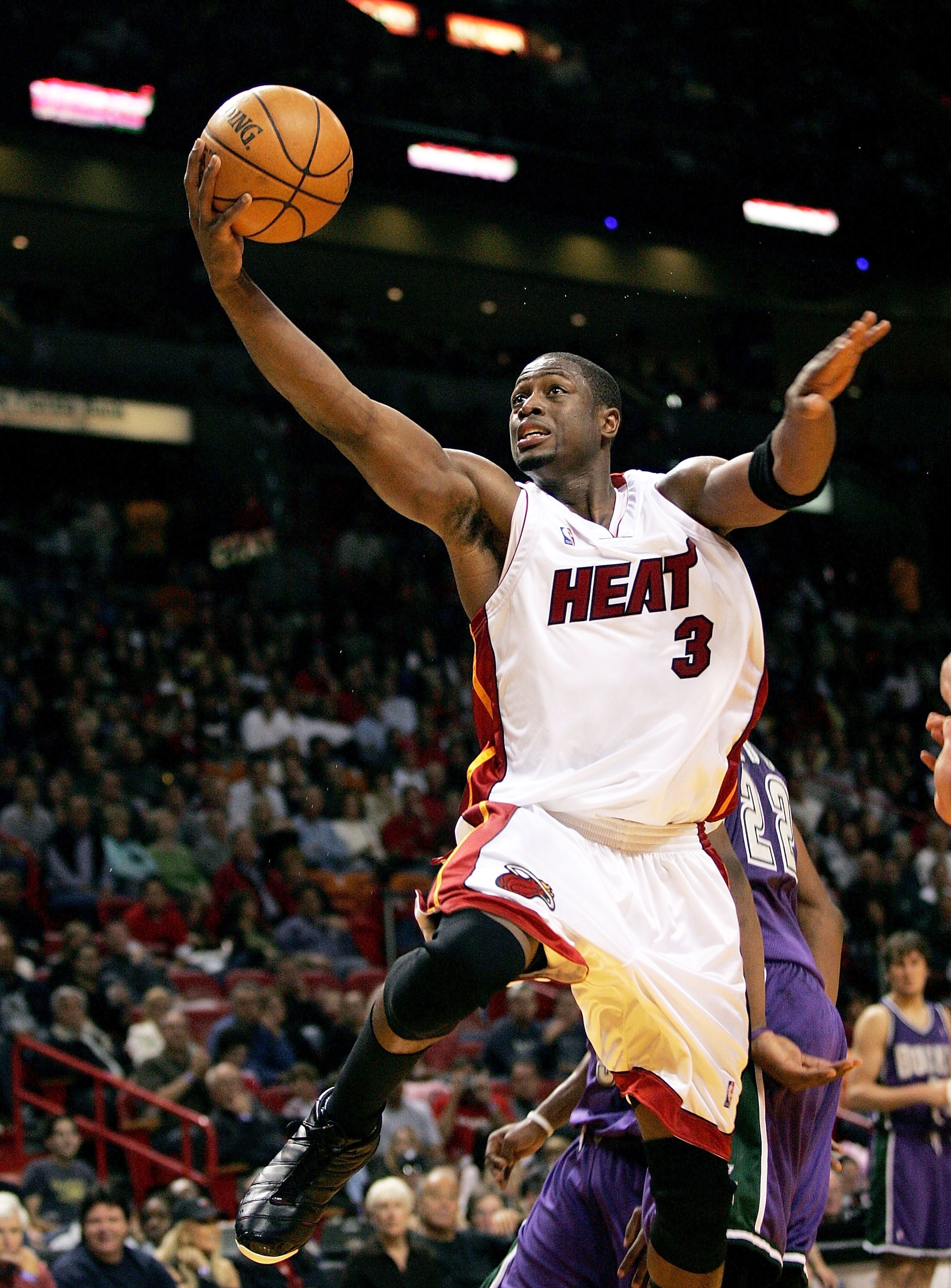 MIAMI - DECEMBER 27: Dwyane Wade #3 of the Miami Heat handles the ball for a lay up against the Milwaukee Bucks on December 27, 2005 at American Airlines Arena in Miami, Florida. NOTE TO USER: User expressly acknowledges and agrees that, by downloading MIAMI - DECEMBER 27: Dwyane Wade #3 of the Miami Heat handles the ball for a lay up against the Milwaukee Bucks on December 27, 2005 at American Airlines Arena in Miami, Florida. NOTE TO USER: User expressly acknowledges and agrees that, by downloading