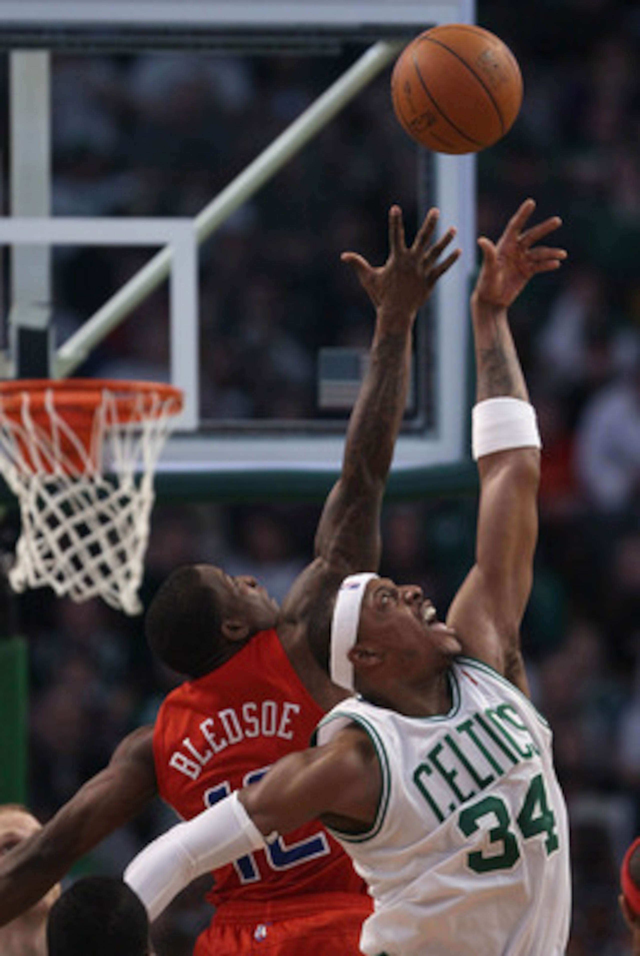 BOSTON, MA - MARCH 09:  Paul Pierce #34 of the Boston Celtics and Eric Bledsoe #12 of the Los Angeles Clippers jump for the ball on March 9, 2011 at the TD Garden in Boston, Massachusetts. The Los Angeles Clippers defeated the Boston Celtics 108-103. NOTE