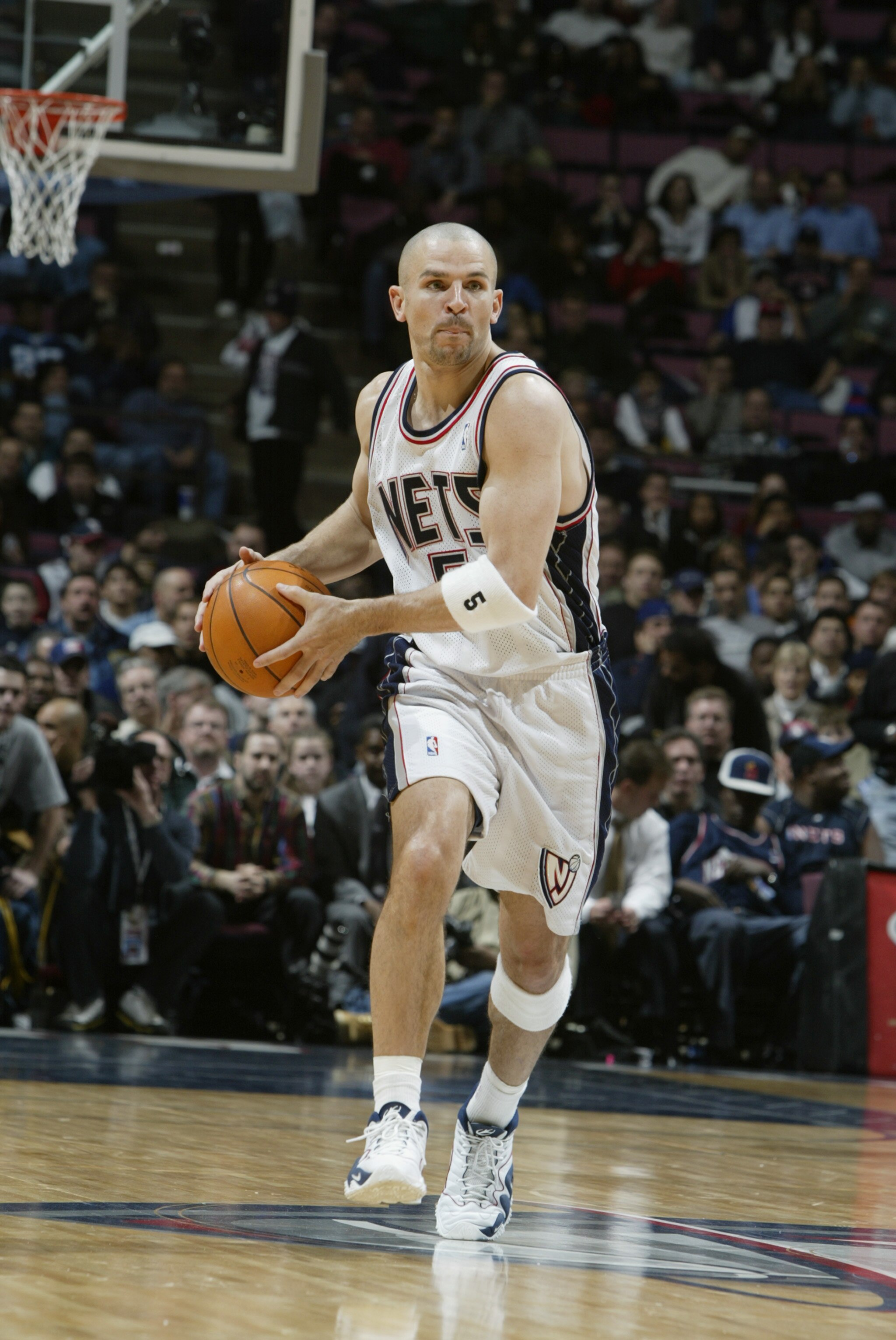 EAST RUTHERFORD, NJ - DECEMBER 9:  Guard Jason Kidd #5 of the New Jersey Nets looks to pass against the Phoenix Suns during the game at Continental Airlines Arena on December 9, 2002 in East Rutherford, New Jersey.  The Nets won 106-93.  NOTE TO USER: Use