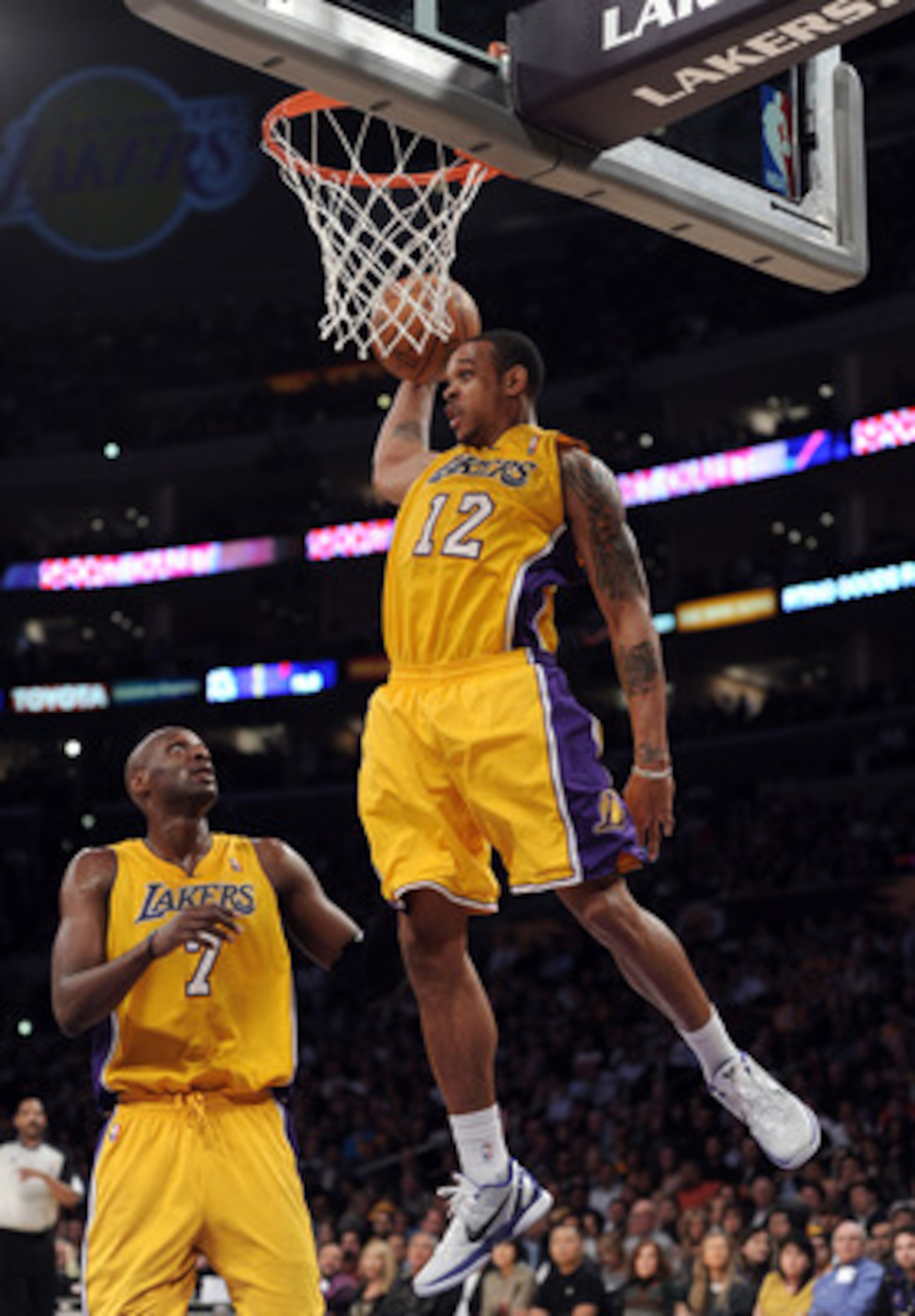 LOS ANGELES, CA - APRIL 12:  Shannon Brown #12 of the Los Angeles Lakers grabs a rebound in front of Lamar Odom #7 against the San Antonio Spurs during the game at Staples Center on April 12, 2011 in Los Angeles, California.  NOTE TO USER: User expressly