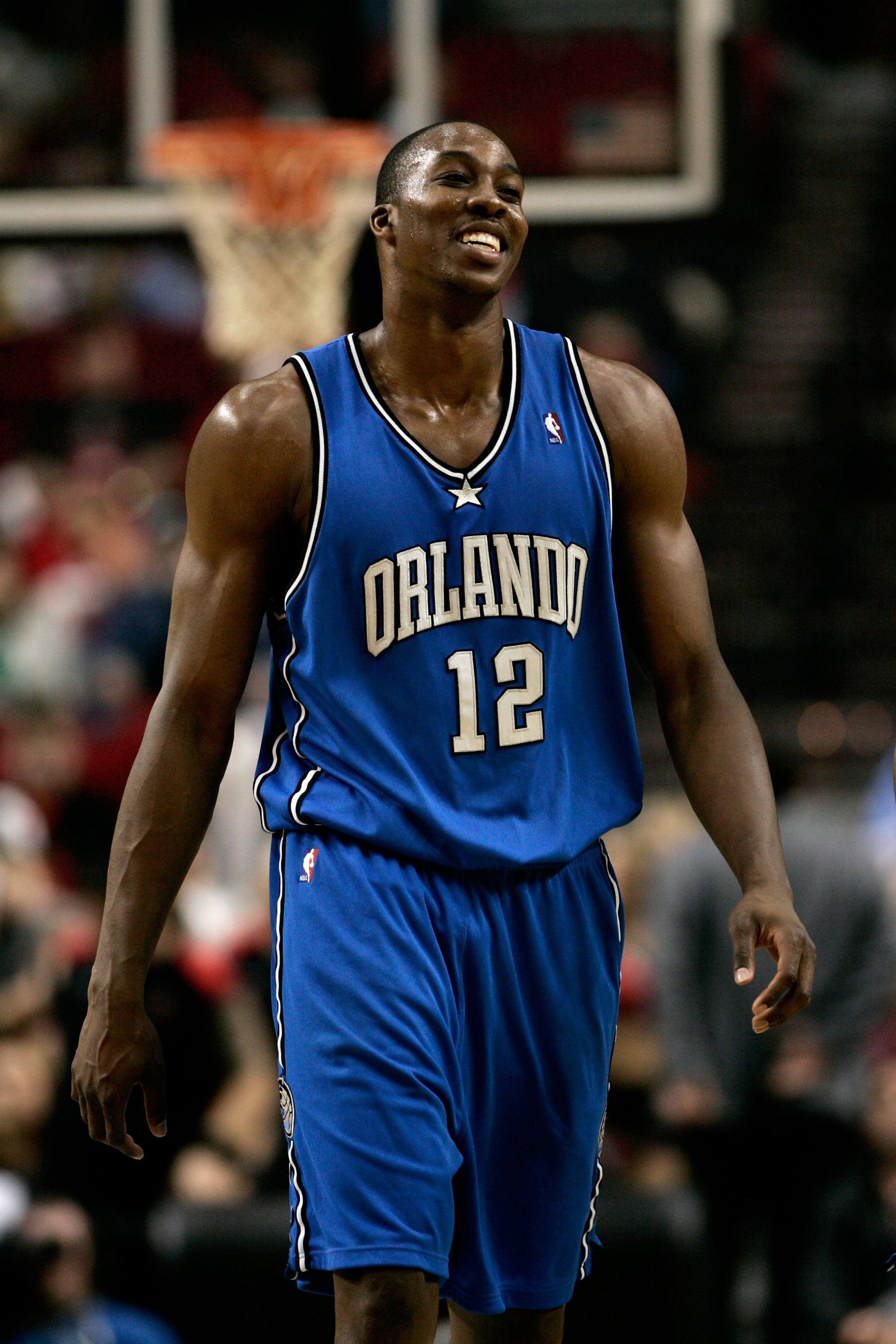PORTLAND, OR - DECEMBER 01: Dwight Howard #12 of the Orlando Magic smiles during a game against the Portland Trail Blazers on December 1, 2006 at the Rose Garden in Portland, Oregon. NOTE TO USER: User expressly acknowledges and agrees that, by download PORTLAND, OR - DECEMBER 01: Dwight Howard #12 of the Orlando Magic smiles during a game against the Portland Trail Blazers on December 1, 2006 at the Rose Garden in Portland, Oregon. NOTE TO USER: User expressly acknowledges and agrees that, by download