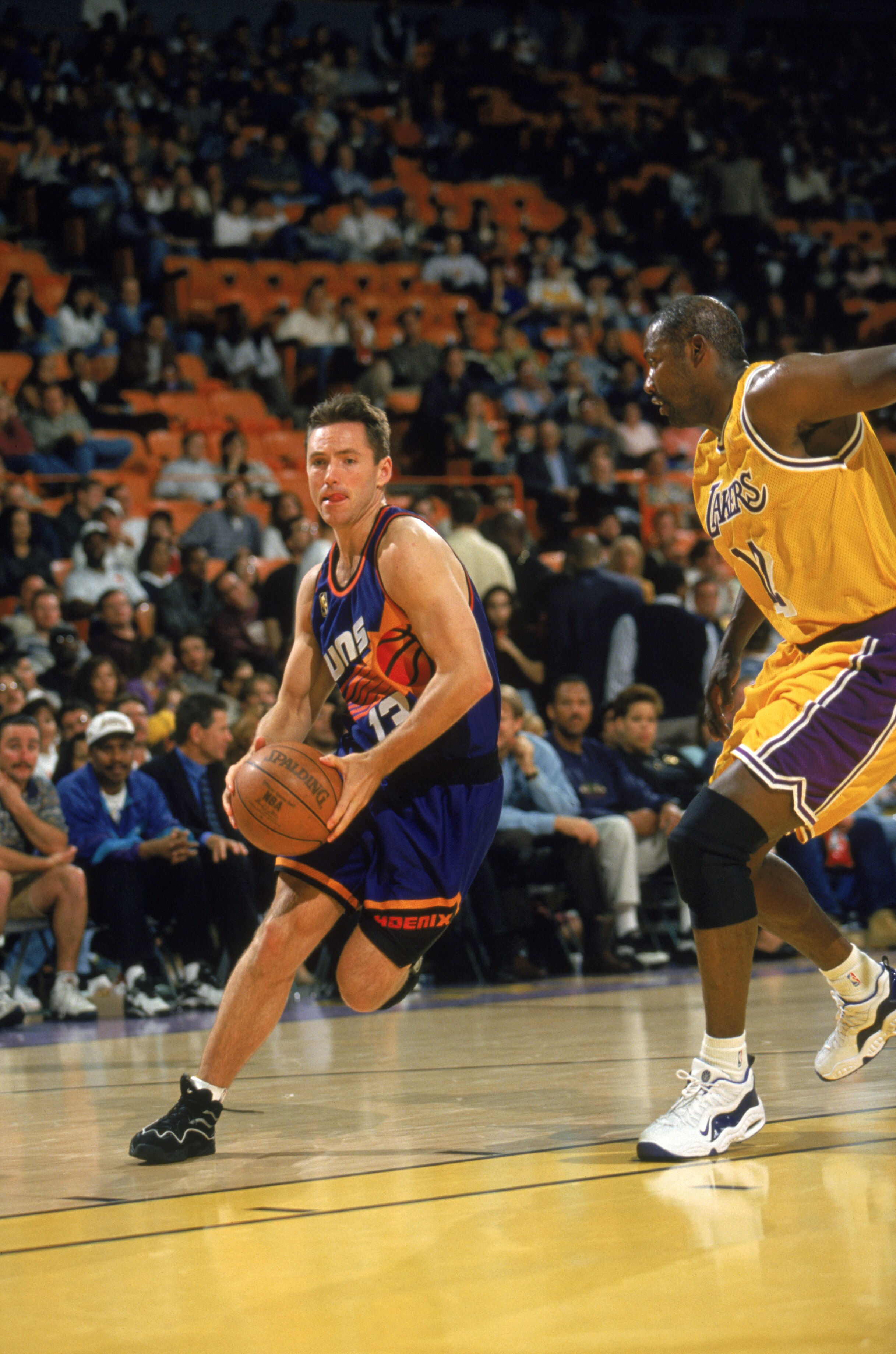 INGLEWOOD - APRIL 11:  Steve Nash #13 of the Phoenix Suns dribbles the ball during the game against the Los Angeles Lakersa at The Forum on April 11,1997 in Inglewood, California. The Lakers won 114-98.  NOTE TO USER: User expressly acknowledges and agree
