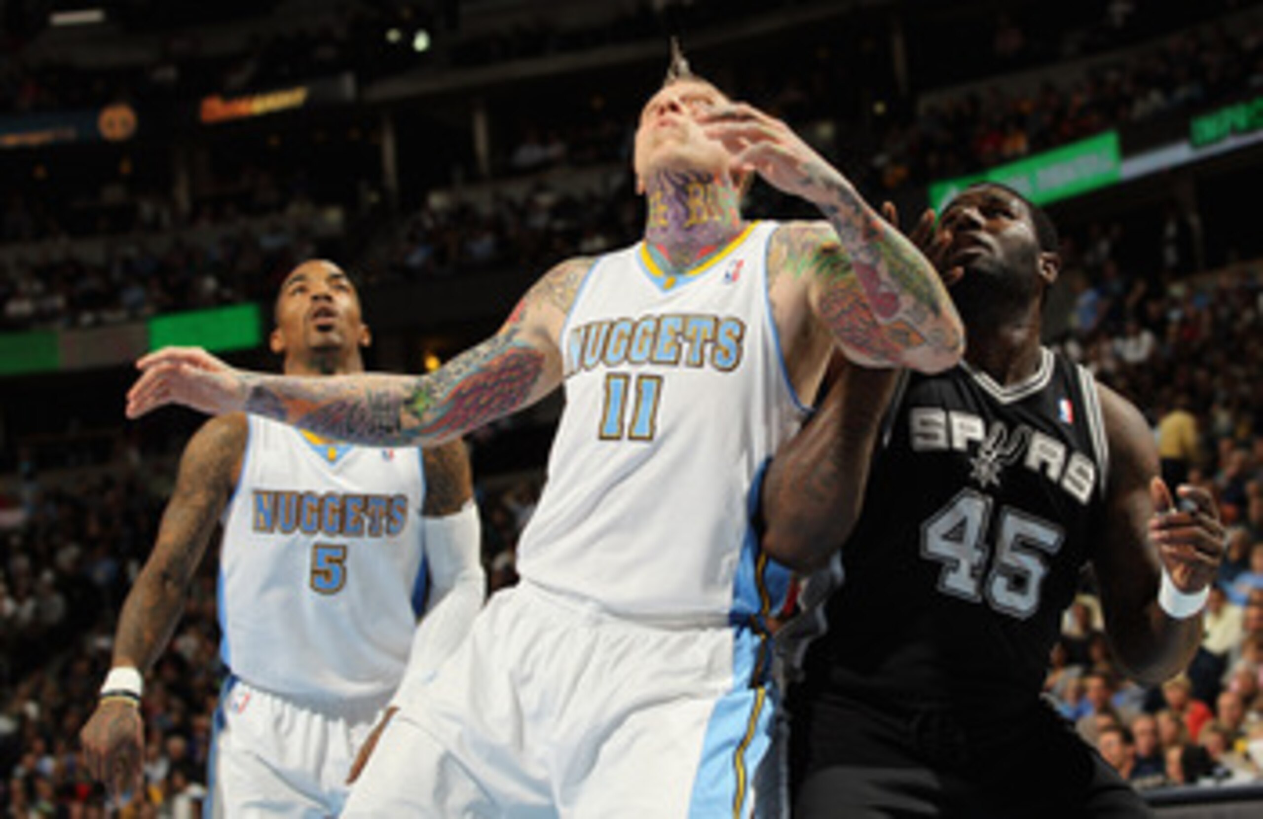 DENVER, CO - MARCH 23:  Chris Andersen #11 of the Denver Nuggets battle for position with DeJuan Blair #45 of the San Antonio Spurs at the Pepsi Center on March 23, 2011 in Denver, Colorado. The Nuggets defeated the Spurs 115-112. NOTE TO USER: User expre