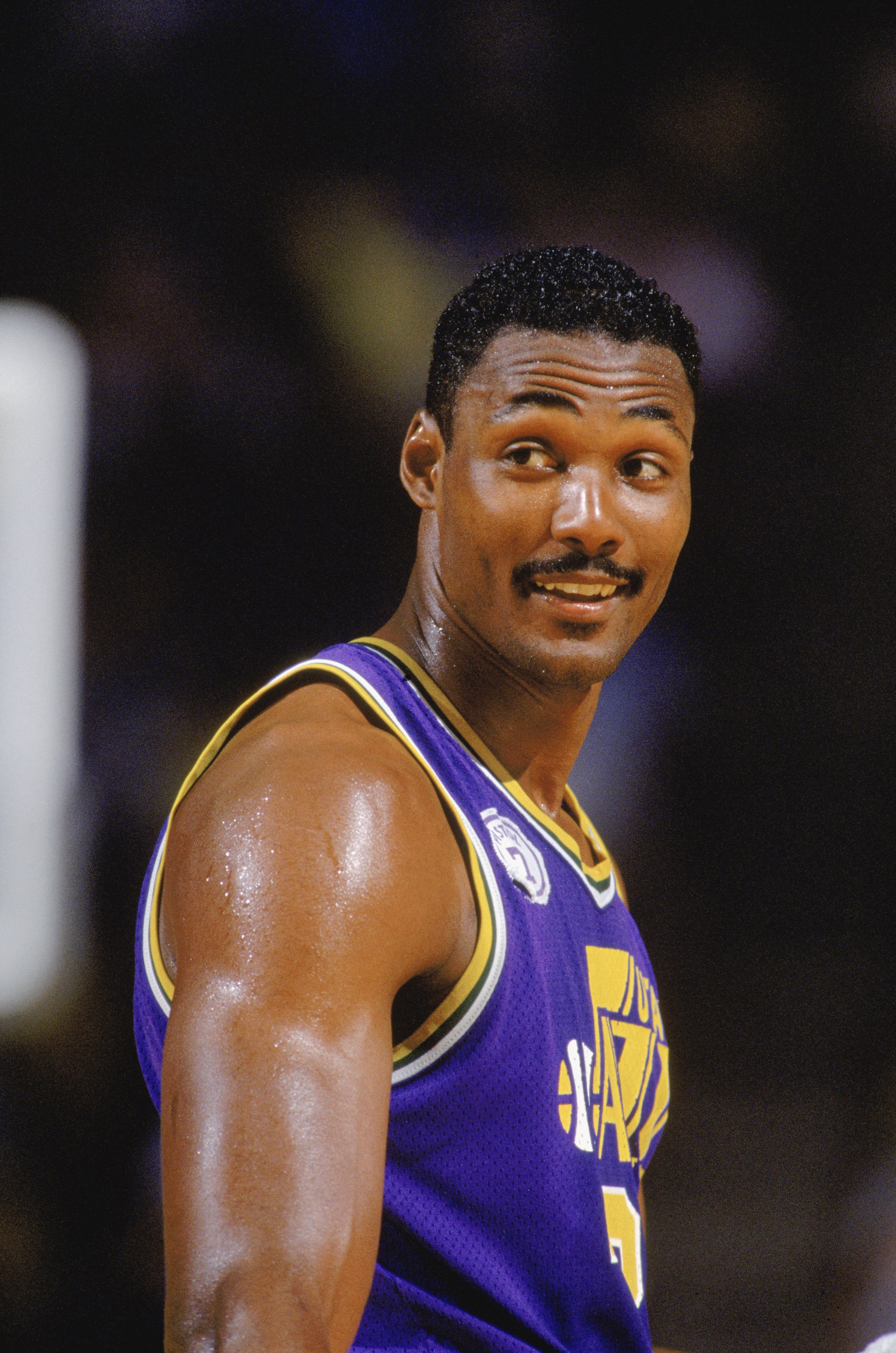 SALT LAKE CITY - 1989: Karl Malone #32 of the Utah Jazz smiles during an NBA game at The Salt Palace in Salt Lake City, Utah in 1989. (Photo by Rick Stewart/Getty Images) SALT LAKE CITY - 1989: Karl Malone #32 of the Utah Jazz smiles during an NBA game at The Salt Palace in Salt Lake City, Utah in 1989. (Photo by Rick Stewart/Getty Images)