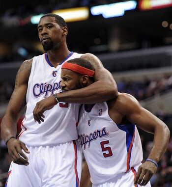 LOS ANGELES, CA - DECEMBER 01:  Baron Davis #5 and DeAndre Jordan #9 of the Los Angeles Clippers reacts after a defensive stop against the San Antonio Spurs during a 90-85 Clipper win at the Staples Center on December 1, 2010 in Los Angeles, California.  