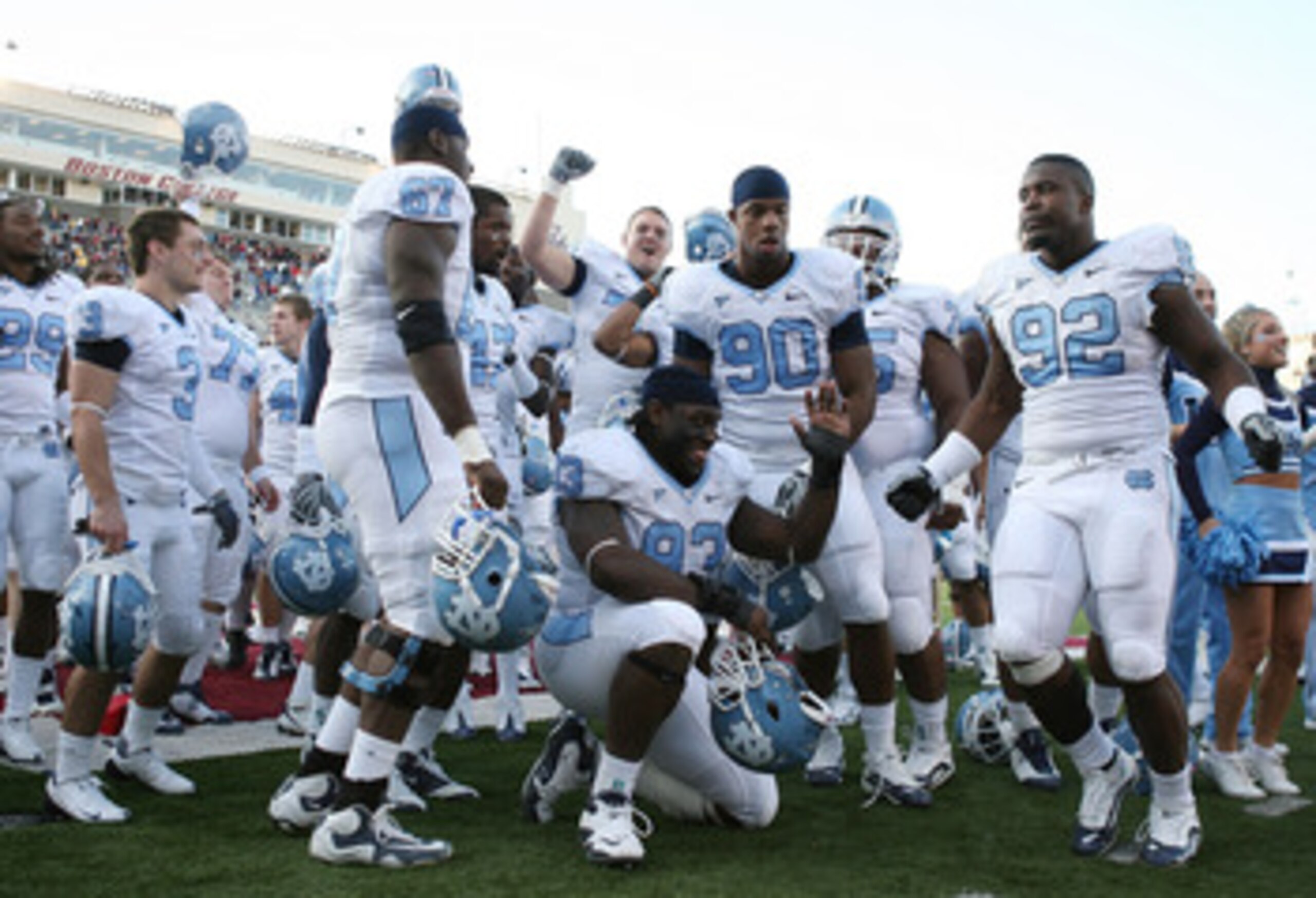 CHESTNUT HILL, MA - NOVEMBER 21:  E.J. Wilson #92 ,Greg Elleby #67, Cam Thomas #93 and Quinton Coples #90 of the North Carolina Tar Heels celebrate after the game against the Boston College Eagles on November 21, 2009 at Alumni Stadium in Chestnut Hill, M