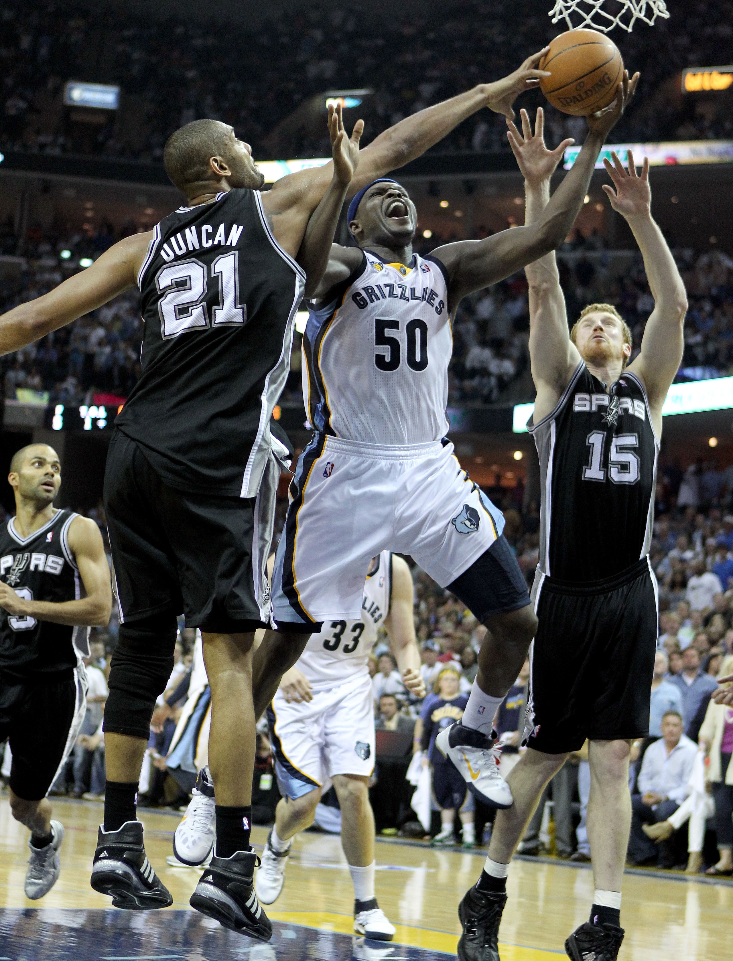 MEMPHIS, TN - APRIL 23: Zach Randolph #50 of the Memphis Grizzlies shoots the ball while defended by Tim Duncan #21 of the San Antonio Spurs  in Game three of the Western Conference Quarterfinals in the 2011 NBA Playoffs at FedExForum on April 23, 2011 in