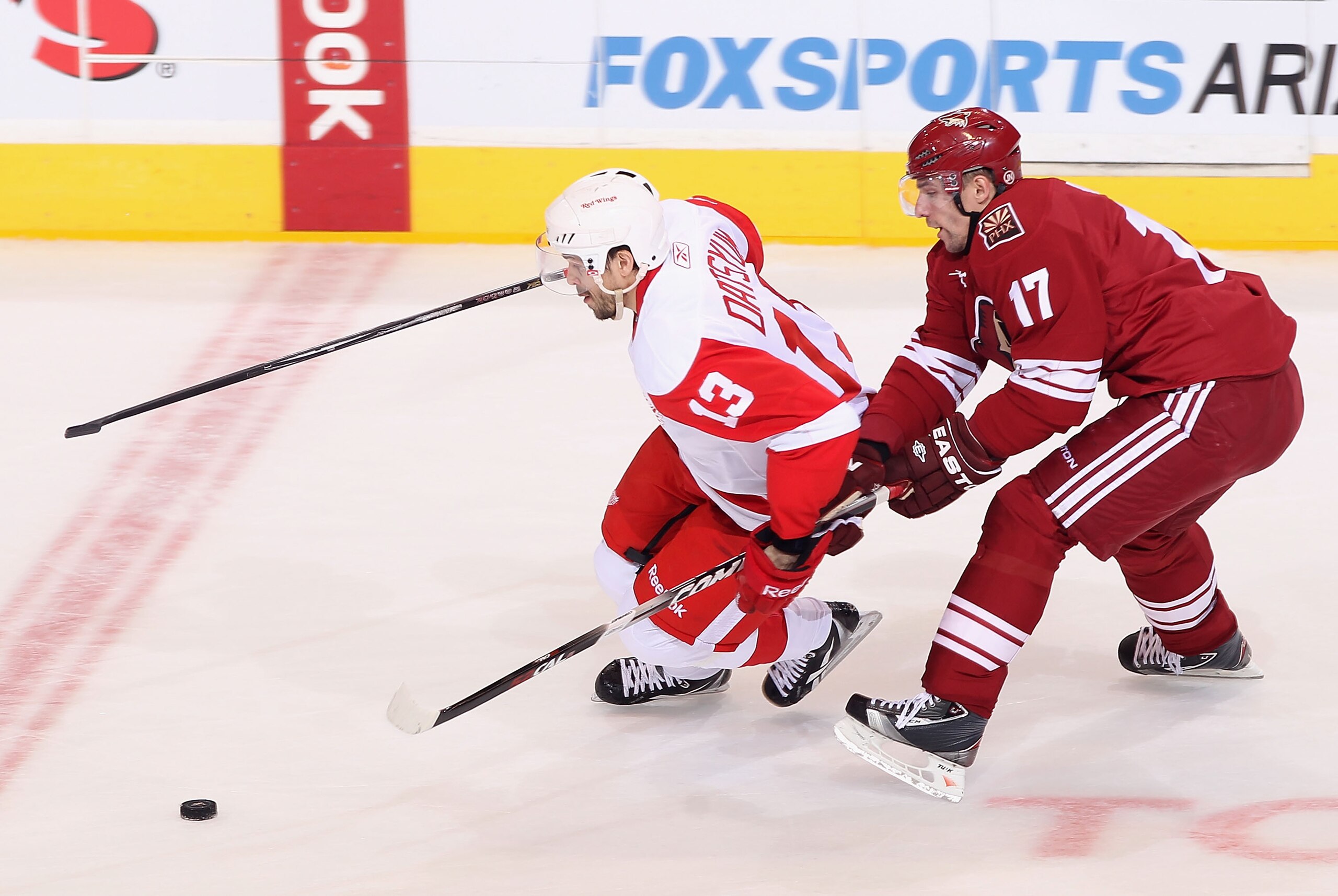 GLENDALE, AZ - APRIL 20:  Pavel Datsyuk #13 of the Detroit Red Wings skates with the puck past Radim Vrbata #17 of the Phoenix Coyotes in Game Four of the Western Conference Quarterfinals during the 2011 NHL Stanley Cup Playoffs at Jobing.com Arena on Apr