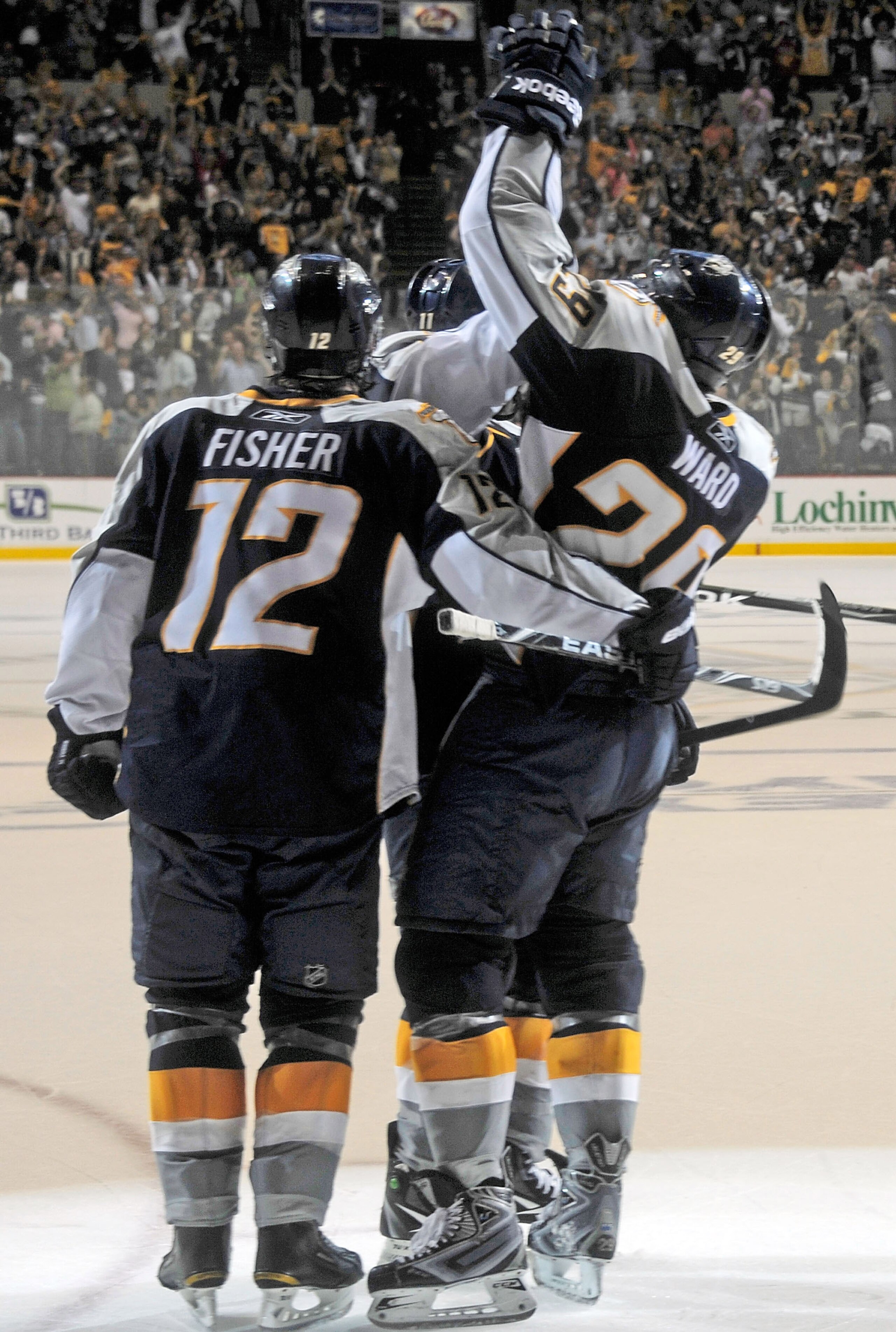 NASHVILLE, TN - APRIL 24:   Mike Fisher #12 and Joel Ward #29 of the Nashville Predators celebrate an open net goal, sealing a victry over the Anaheim Ducks in Game Six of the Western Conference Quarterfinals during the 2011 NHL Stanley Cup Playoffs at Br