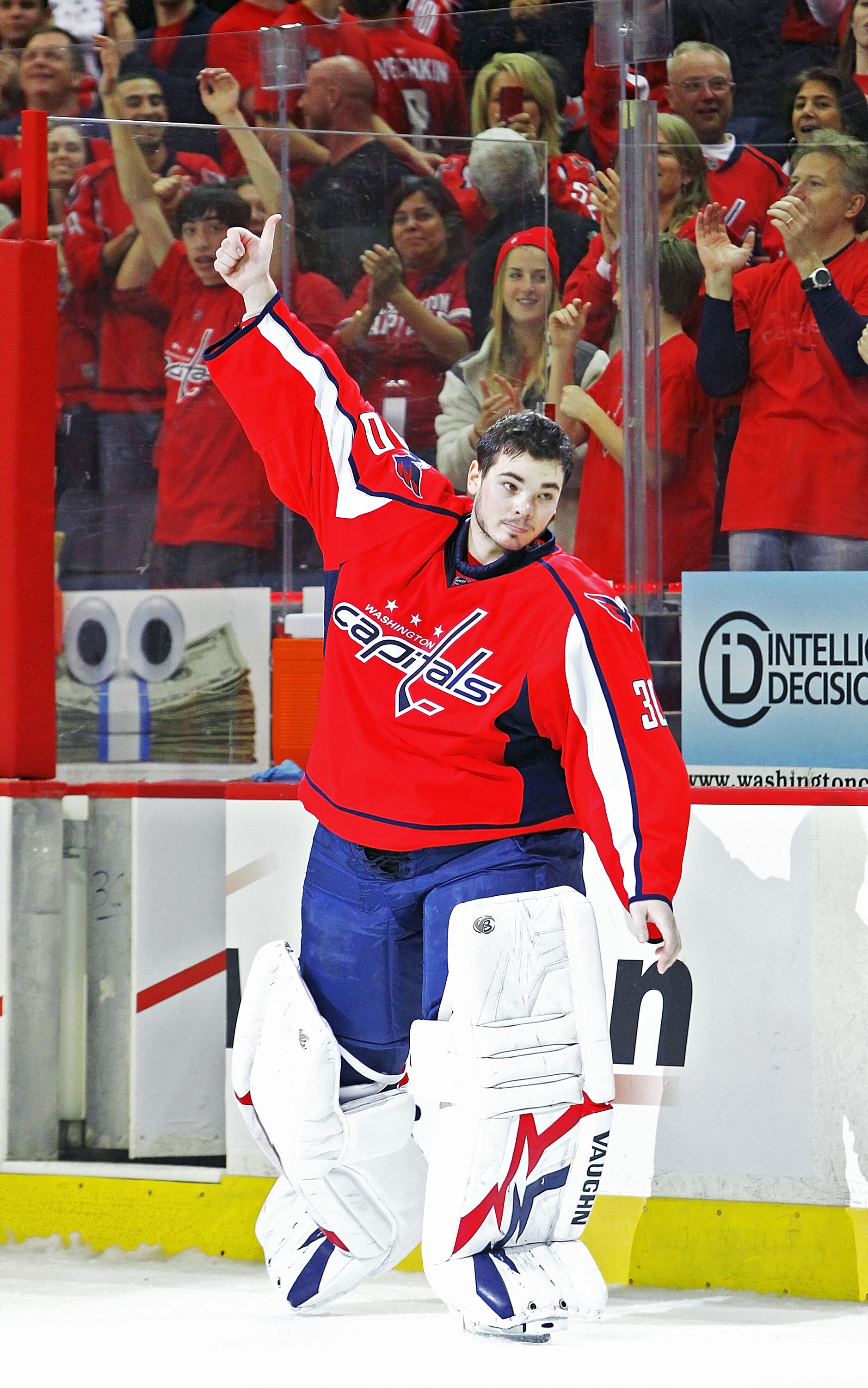 PHILADELPHIA , PA - APRIL 23:  Michal Neuvirth #30 of the Washington Capitals celebrates being named the first star of the game against the New York Rangers in Game Five of the Eastern Conference Quarterfinals during the 2011 NHL Stanley Cup Playoffs at t