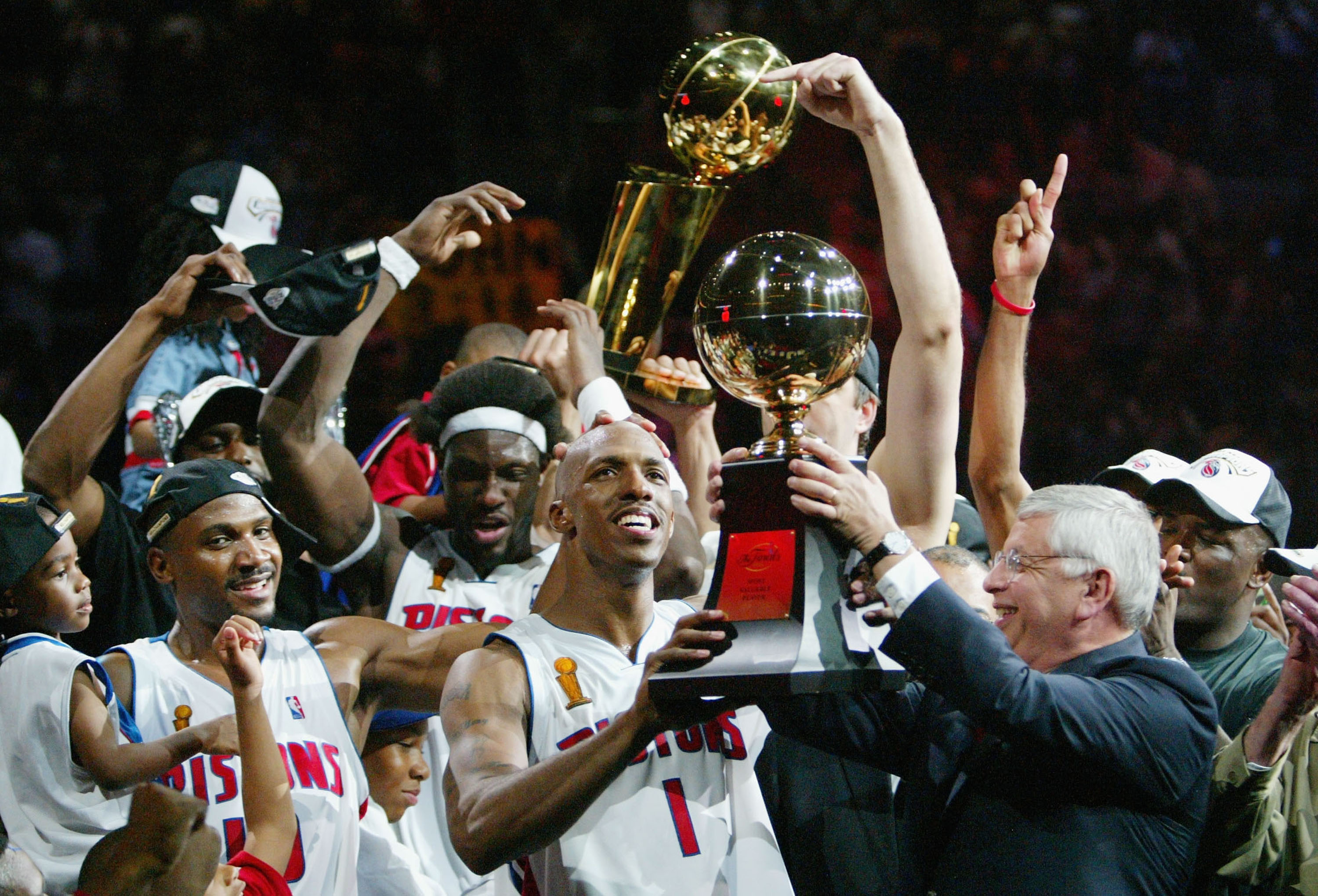 AUBURN HILLS, MI - JUNE 15:  Chauncey Billups #1 (C) of the Detroit Pistons receives the Finals MVP trophy from NBA commissioner David Stern (R) after defeating the Los Angeles Lakers 100-87 in game five of the 2004 NBA Finals on June 15, 2004 at The Pala