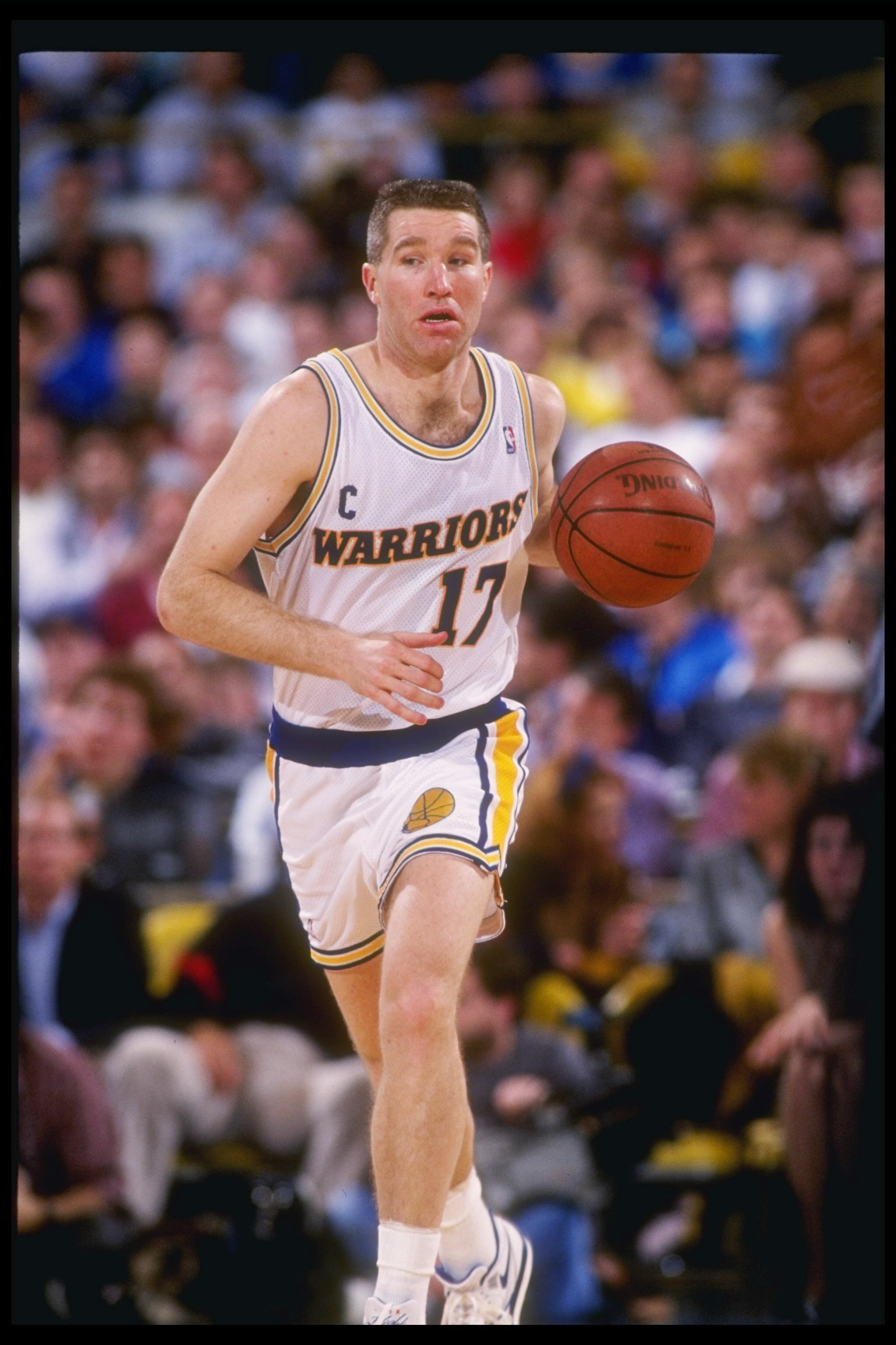 1990-1991:  Forward Chris Mullin of the Golden State Warriors drives the ball down the court during a game against the New York Knicks. Mandatory Credit: Otto Greule  /Allsport