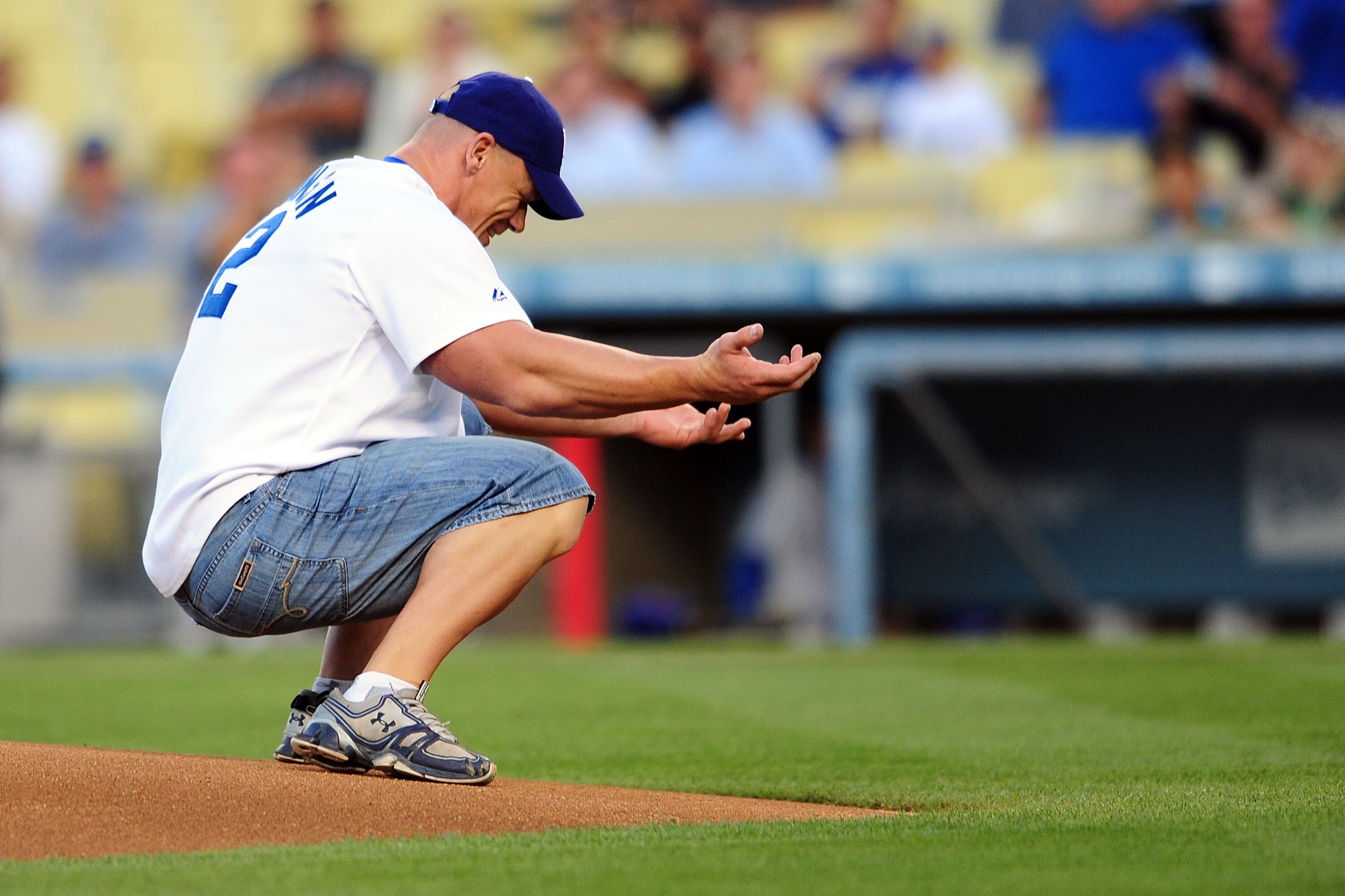 LOS ANGELES, CA - AUGUST 20: WWE Superstar John Cena reacts after throwing the ceremonial first pitch for the Los Angeles Dodgers as they play the Chicago Cubs at Dodger Stadium on August 20, 2009 in Los Angeles, California. (Photo by Jacob de Golish/Gett