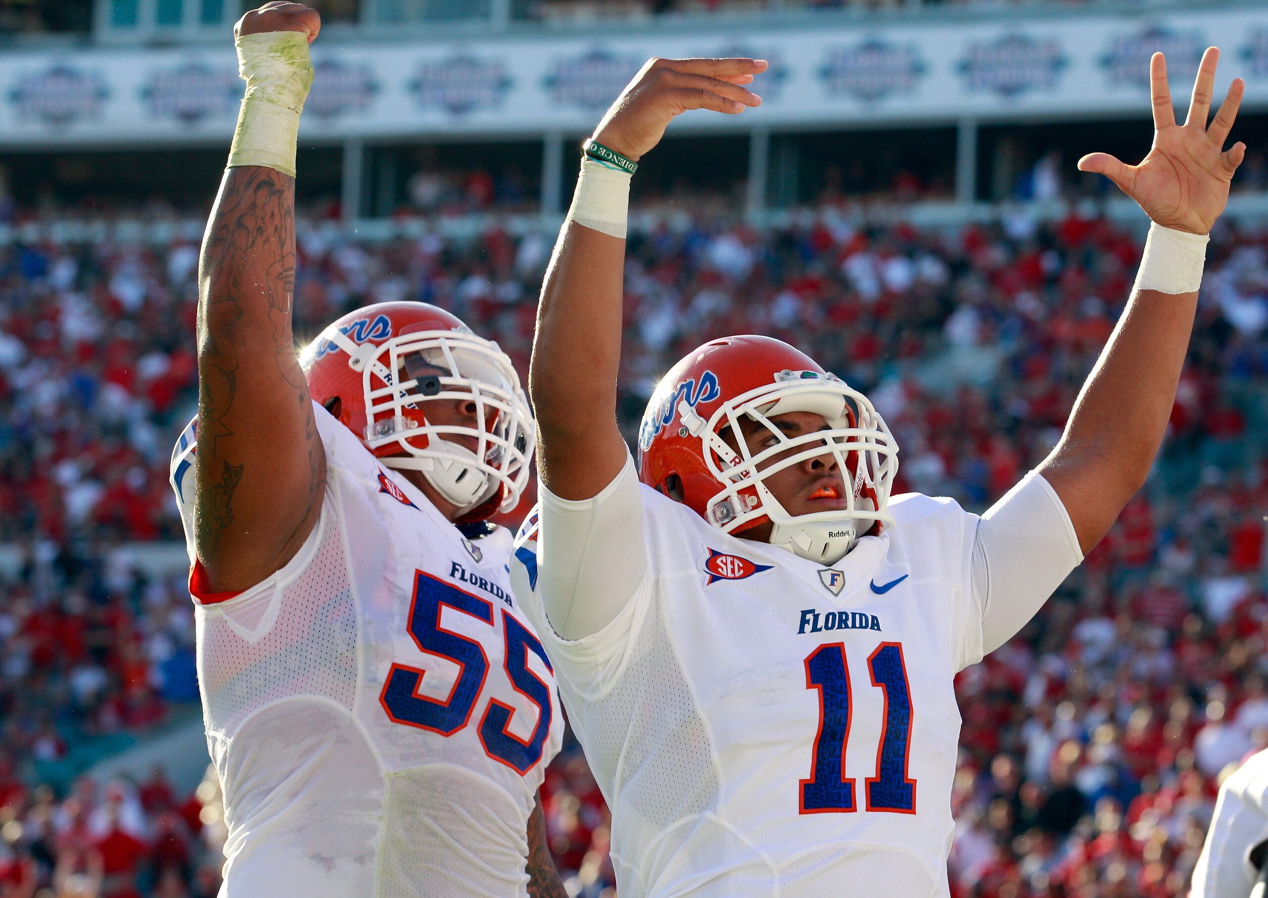 JACKSONVILLE, FL - OCTOBER 30: Jordan Reed #11 and Mike Pouncey #55 of the Florida Gators celebrate a touchdown during the game against the Georgia Bulldogs at EverBank Field on October 30, 2010 in Jacksonville, Florida. (Photo by Sam Greenwood/Getty Im JACKSONVILLE, FL - OCTOBER 30: Jordan Reed #11 and Mike Pouncey #55 of the Florida Gators celebrate a touchdown during the game against the Georgia Bulldogs at EverBank Field on October 30, 2010 in Jacksonville, Florida. (Photo by Sam Greenwood/Getty Im