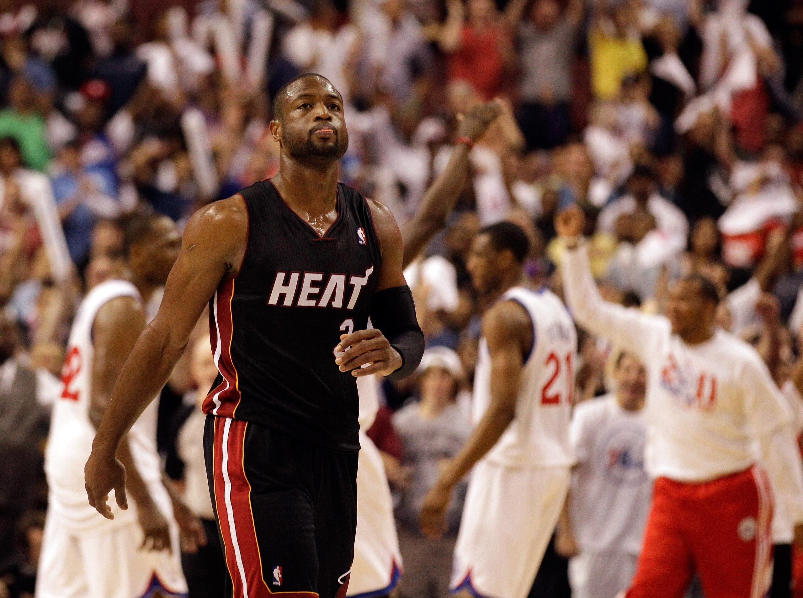 PHILADELPHIA, PA - APRIL 24: Dwyane Wade #3 of the Miami Heat walks off the court as members of the Philadelphia 76ers celebrate their 86-82 win in Game Four of the Eastern Conference Quarterfinals in the 2011 NBA Playoffs at Wells Fargo Center on April 2 PHILADELPHIA, PA - APRIL 24: Dwyane Wade #3 of the Miami Heat walks off the court as members of the Philadelphia 76ers celebrate their 86-82 win in Game Four of the Eastern Conference Quarterfinals in the 2011 NBA Playoffs at Wells Fargo Center on April 2