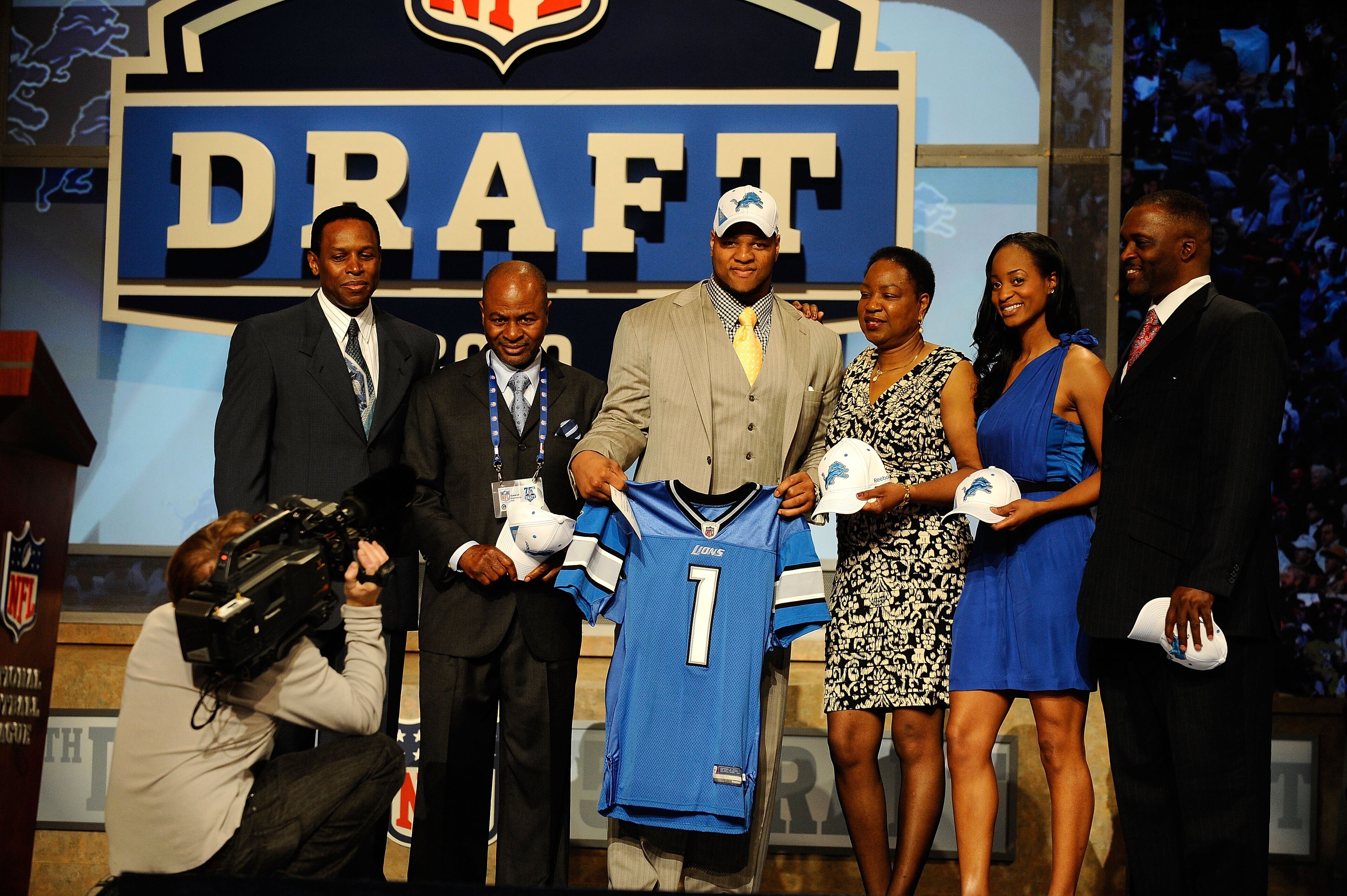 NEW YORK - APRIL 22:  Ndamukong Suh of the Nebraska Cornhuskers holds up a Detroit Lions jersey as he poses with family after he was picked #2 overall by the Lions during the first round of the 2010 NFL Draft at Radio City Music Hall on April 22, 2010 in 
