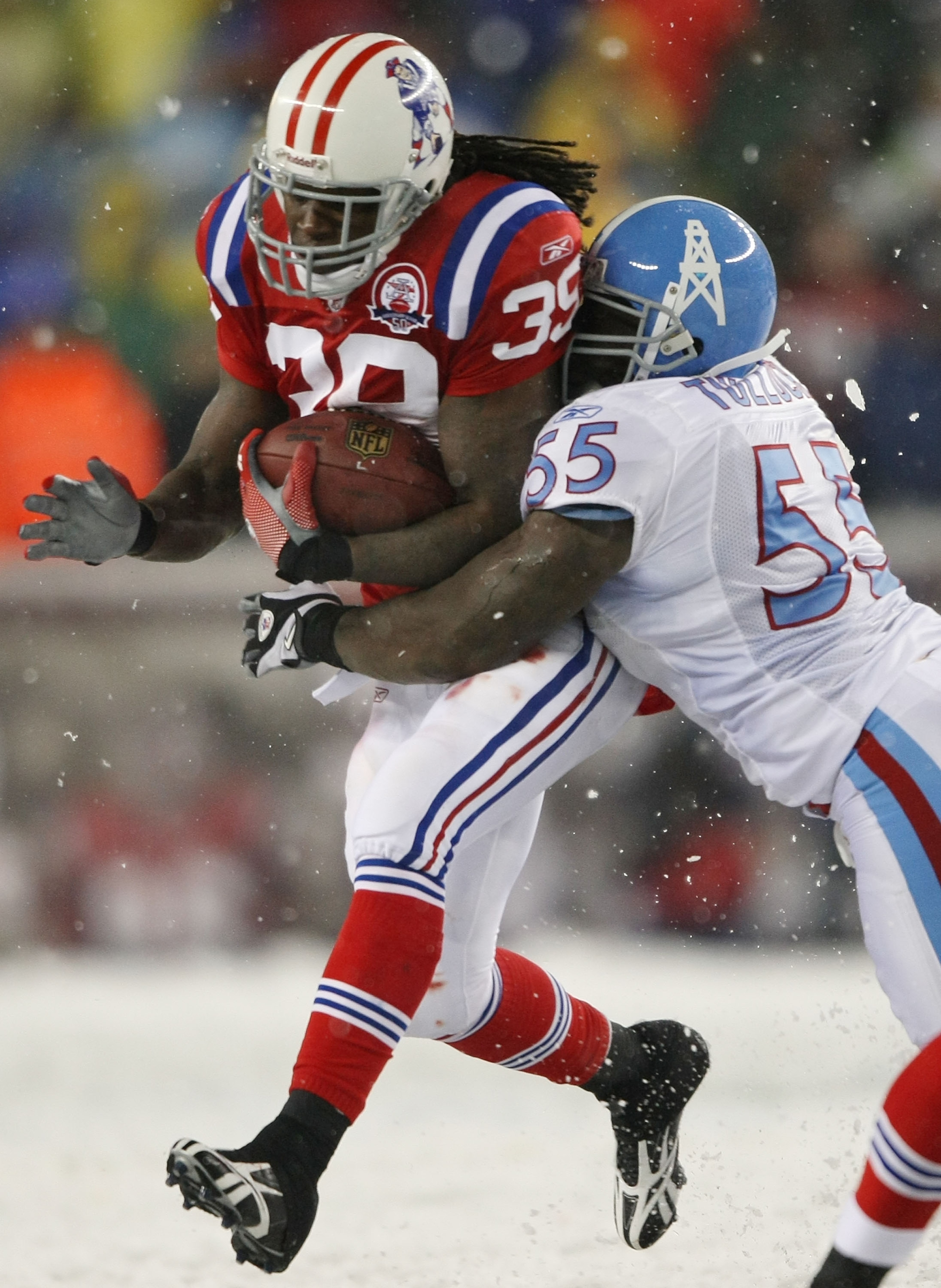 FOXBORO, MA - OCTOBER 18:  Laurence Maroney #39 of the New England Patriots is tackled Stephen Tulloch #55 of the Tennessee Titans on October 18, 2009 at Gillette Stadium in Foxboro, Massachusetts. The Patriots defeated the Titans 59-0.  (Photo by Elsa/Ge