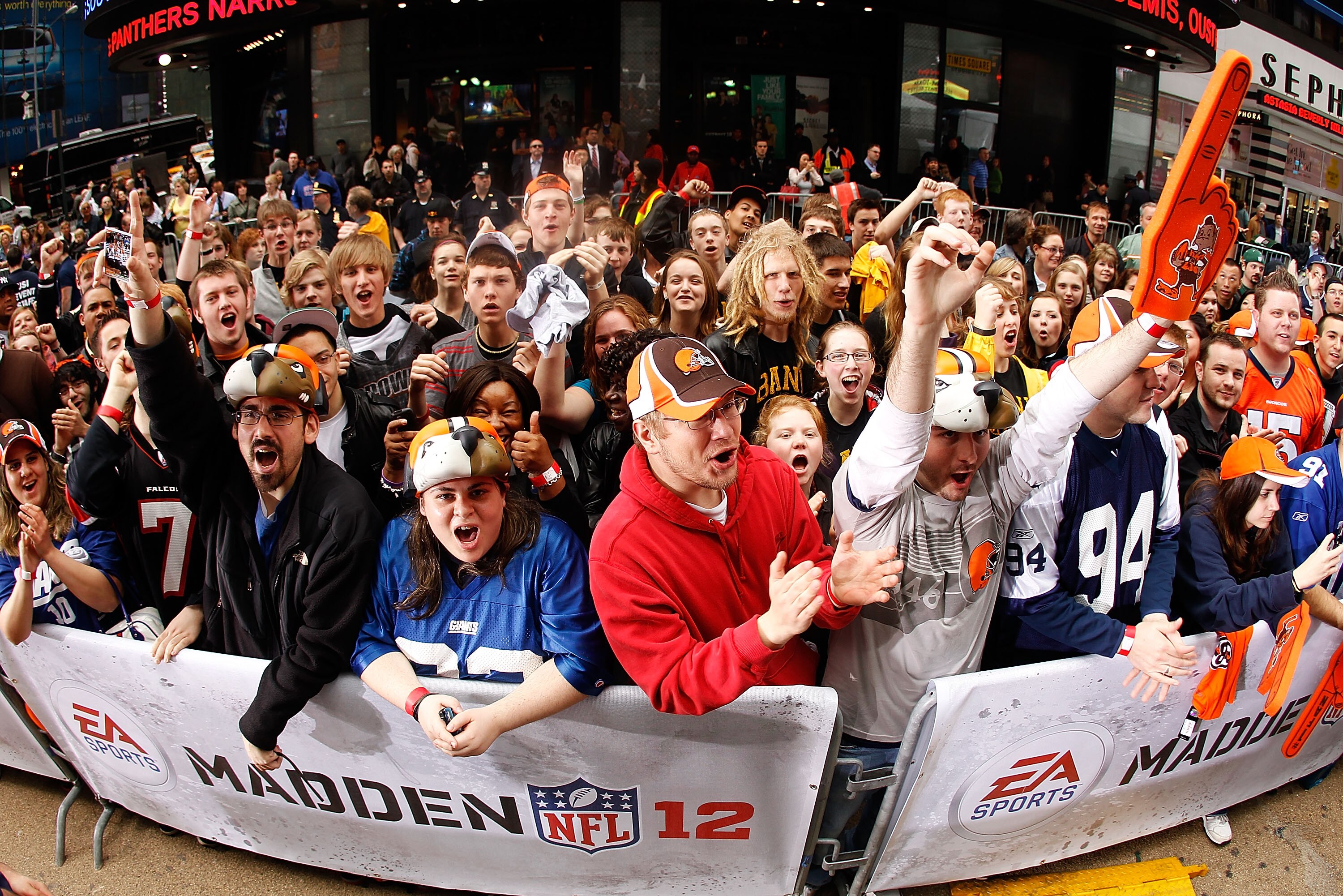 NEW YORK - APRIL 28:  Fans cheer during the EA Sports Madden NFL 12 cover photo shoot on April 28, 2011 in Time Square, New York City  (Photo by Mike Stobe/Getty Images for EA Sports)