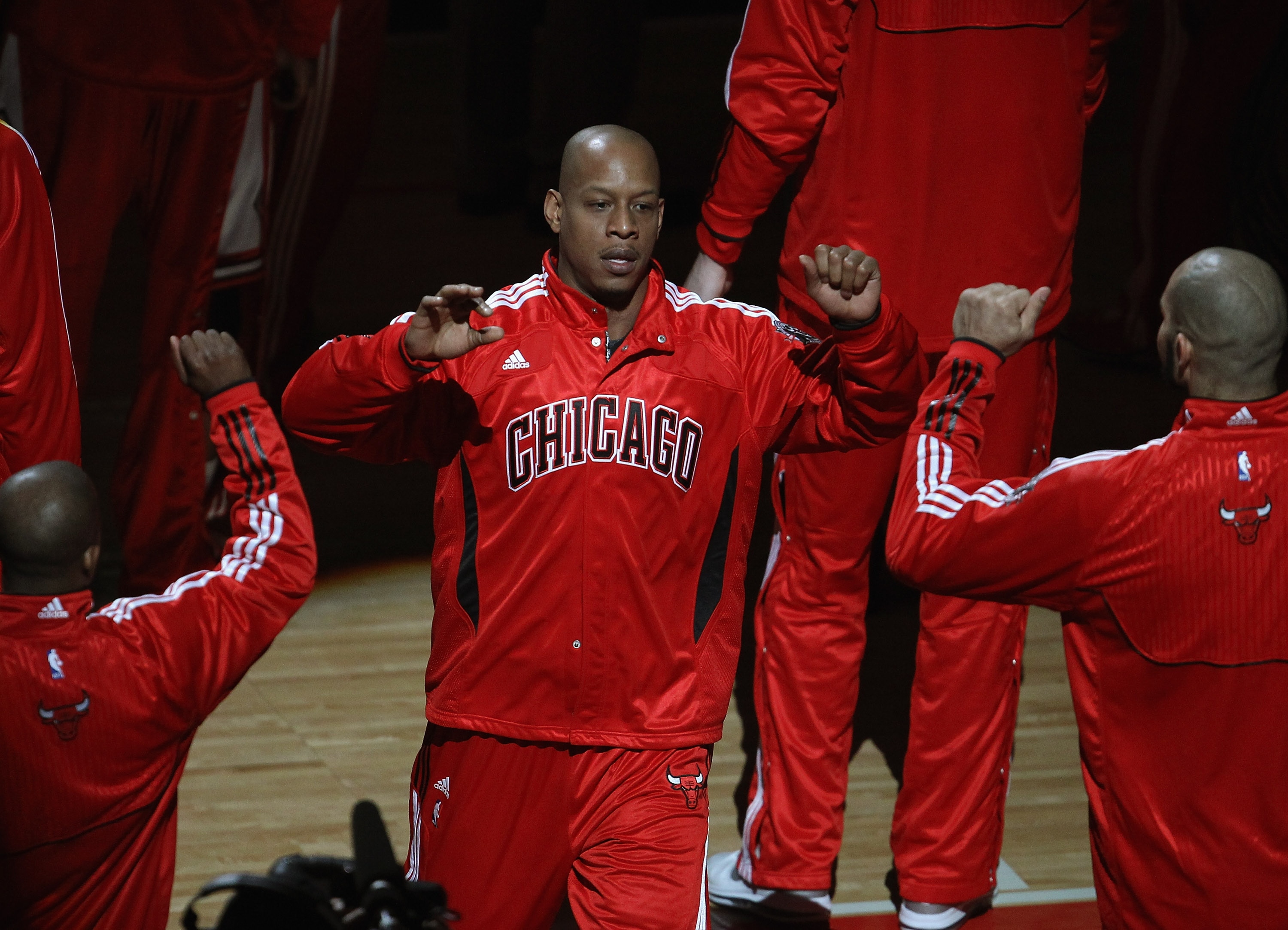 CHICAGO, IL - APRIL 13: Keith Bogans #6 of the Chicago Bulls is greeted by teammates during player introductions before a game against the New Jersey Nets at the United Center on April 13, 2011 in Chicago, Illinois. The Bulls defeated the Nets 97-92. NOTE