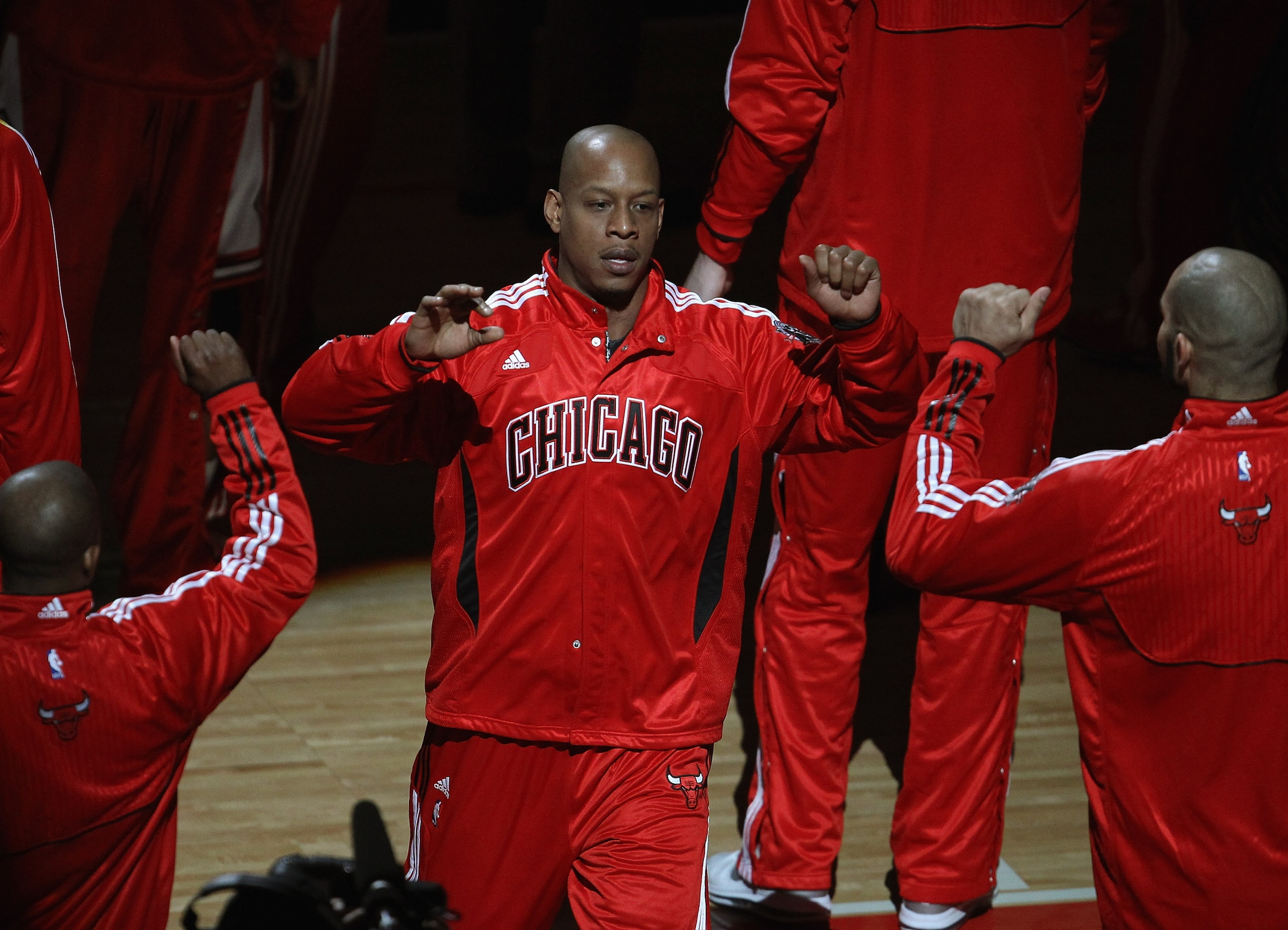 CHICAGO, IL - APRIL 13: Keith Bogans #6 of the Chicago Bulls is greeted by teammates during player introductions before a game against the New Jersey Nets at the United Center on April 13, 2011 in Chicago, Illinois. The Bulls defeated the Nets 97-92. NOTE