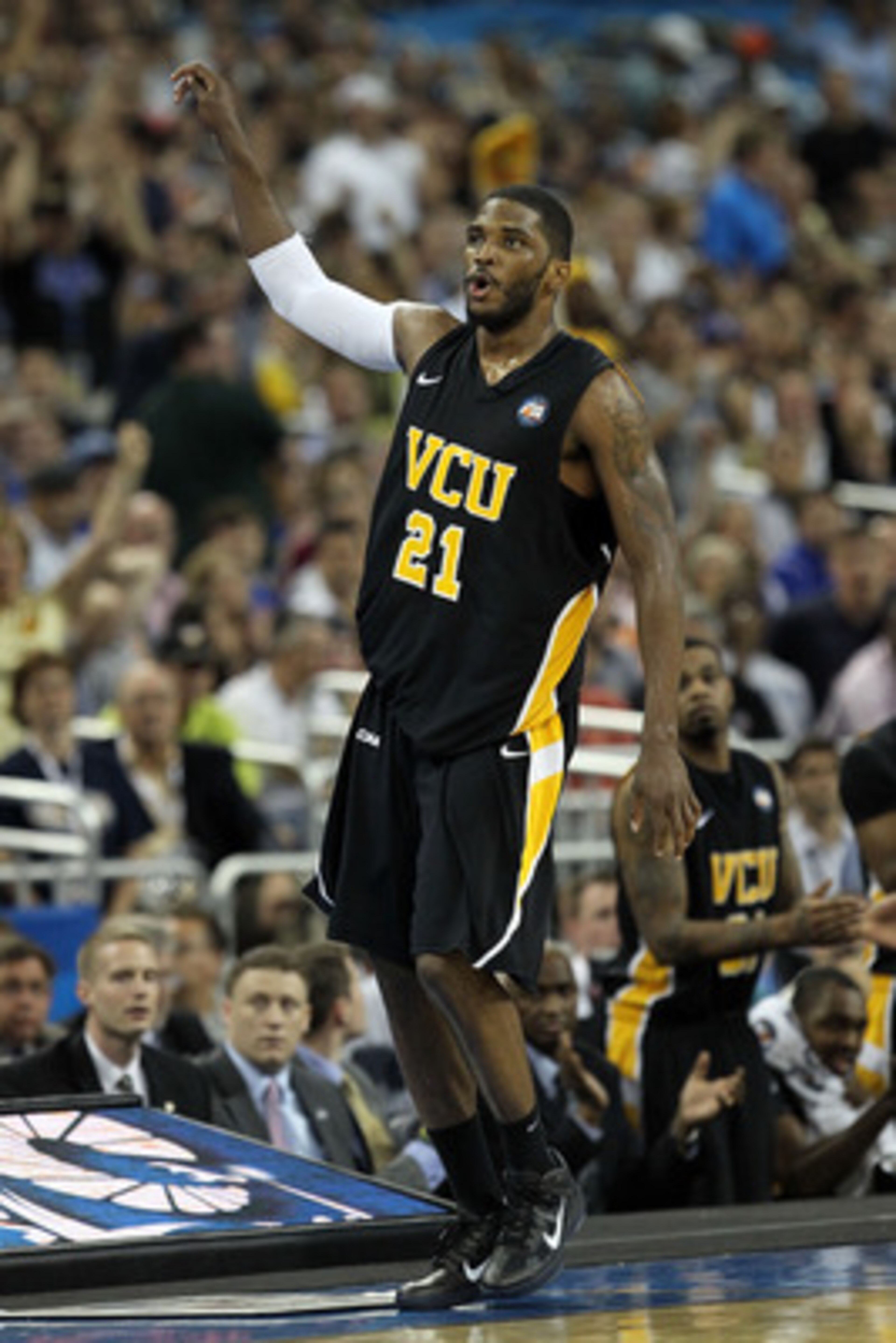 HOUSTON, TX - APRIL 02:  Jamie Skeen #21 of the Virginia Commonwealth Rams reacts after hitting a three pointer and drawing a foul against the Butler Bulldogs during the National Semifinal game of the 2011 NCAA Division I Men's Basketball Championship at